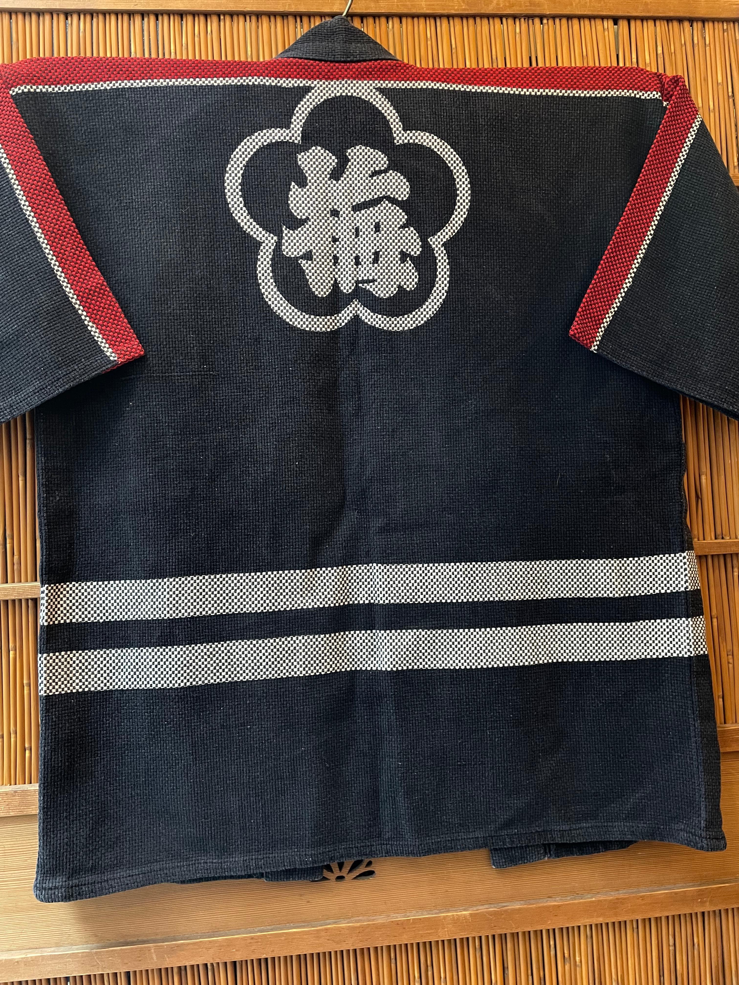 This Sashiko b(h)anten was made around 1920-1926 in Taisho era in Japan. 
On the front, it is written 'Member of Vigilance Committee Umezonocho ' in Japanese. On the back, it is written 'Ume'.

Sashiko banten is a hanten for firefighters, which
