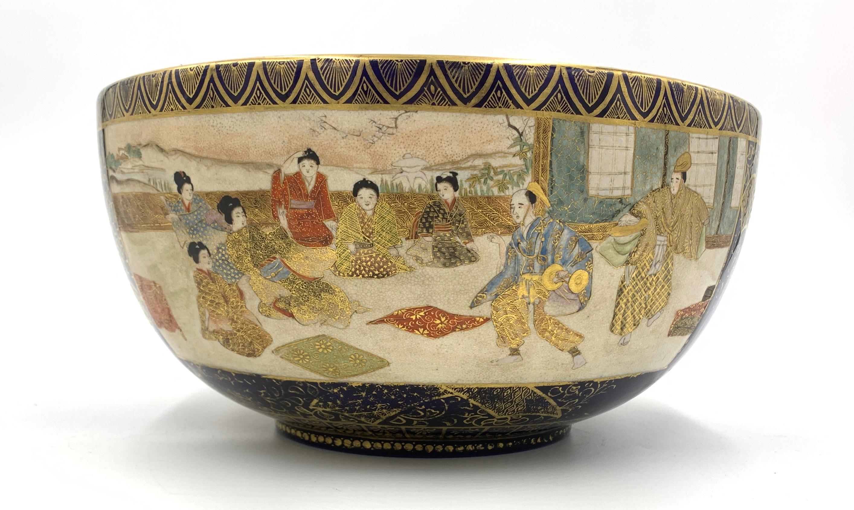 Signed, Meiji period (late 19th century), Decorated in various coloured enamels and lavish gilt on a blue ground with panels containing samurai, ladies in kimono, the interior with a large panel of samurai.
 