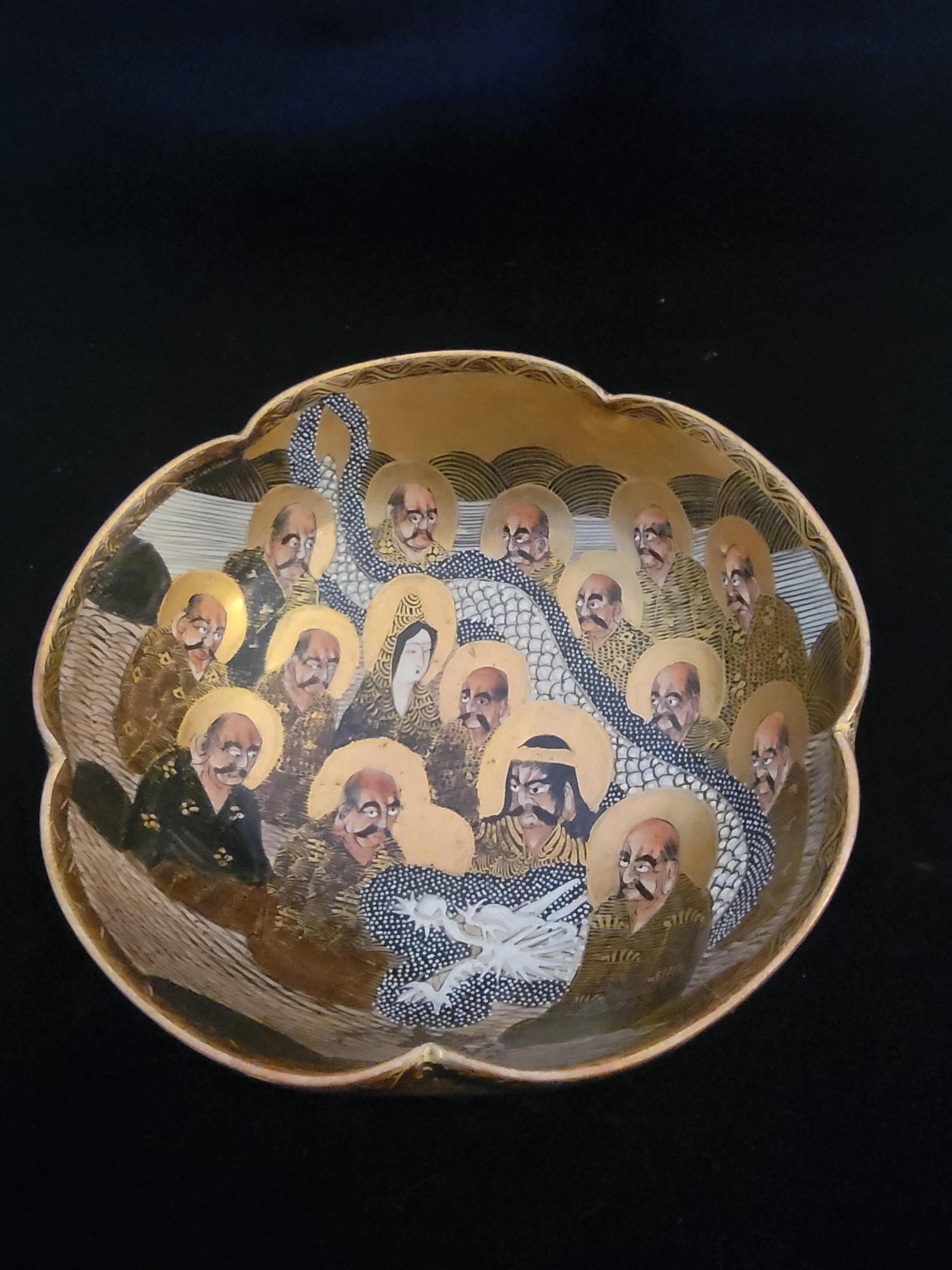 This is an amazing piece. It is not only stamped, Itis also signed by the artist. it is a Bowl of the Immortals. Shimazumon (emblem) on bottom .Meiji Period 1868-1912. It is quite a densely detailed bowl with scenes of the Immortals and black and