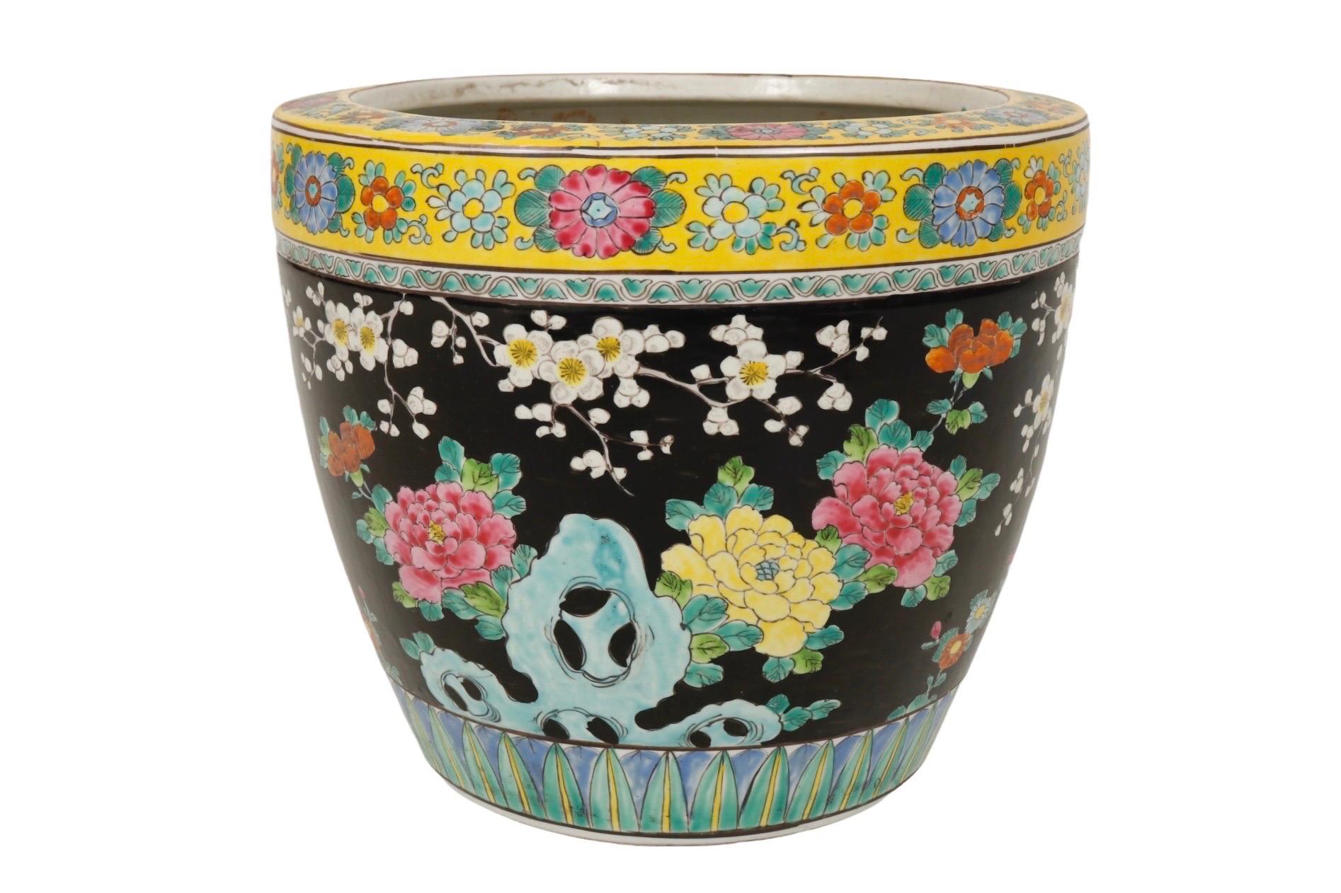 A Japanese hand painted Satsuma earthenware planter. The satsuma mark, often incorporated in the design, can be seen in the large green plant-like ribbon on the back. Made of earthenware, it’s decorated with two ornately detailed pheasants, large