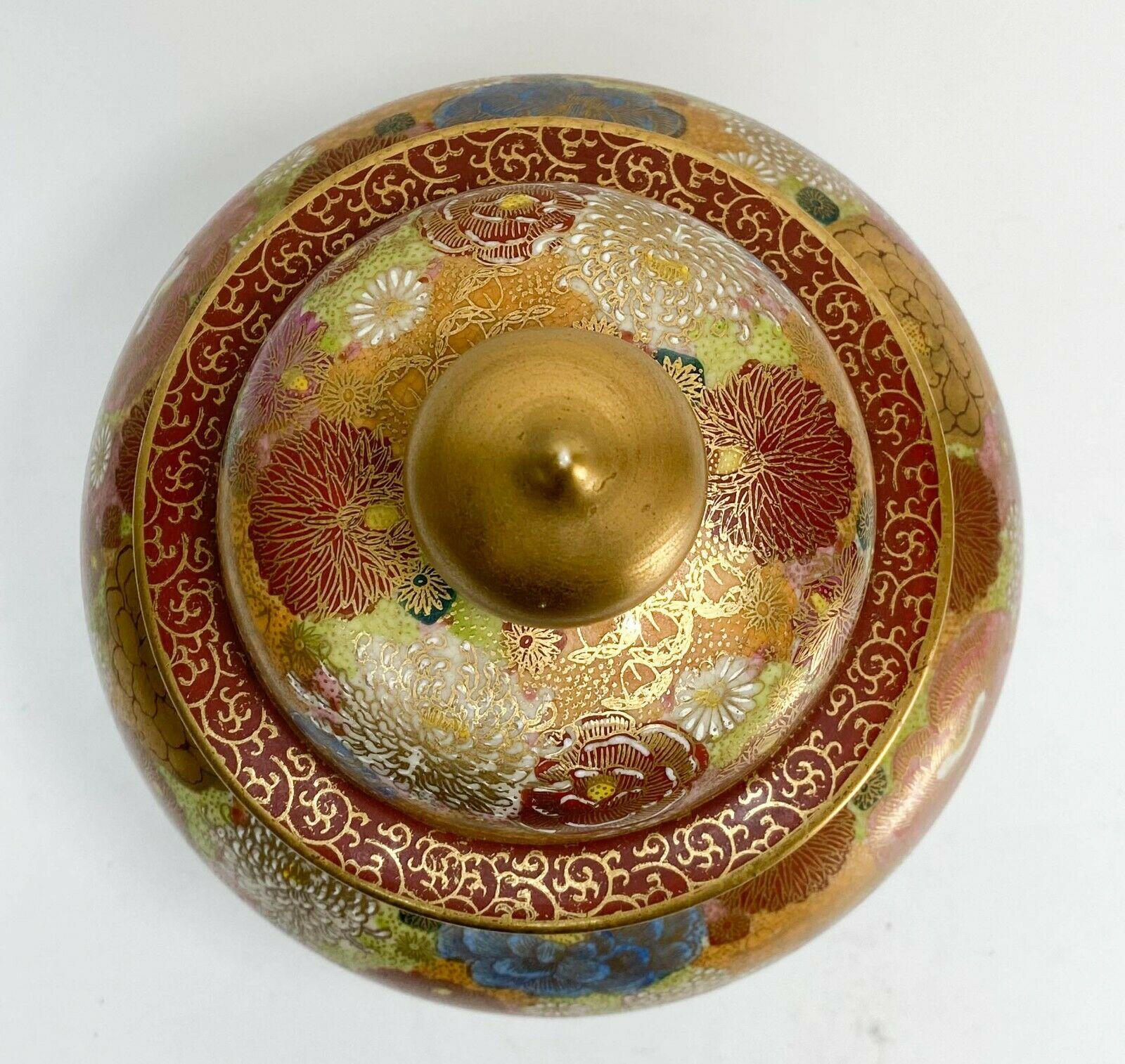 Japanese Satsuma Mille Fleur Hand Painted Porcelain lidded urn, Possibly Meiji

Colorful ground covered in gilt hand painted flowers throughout. Japanese mark to underside.

Additional Information:
Featured Refinements: satsuma vase 
Region of
