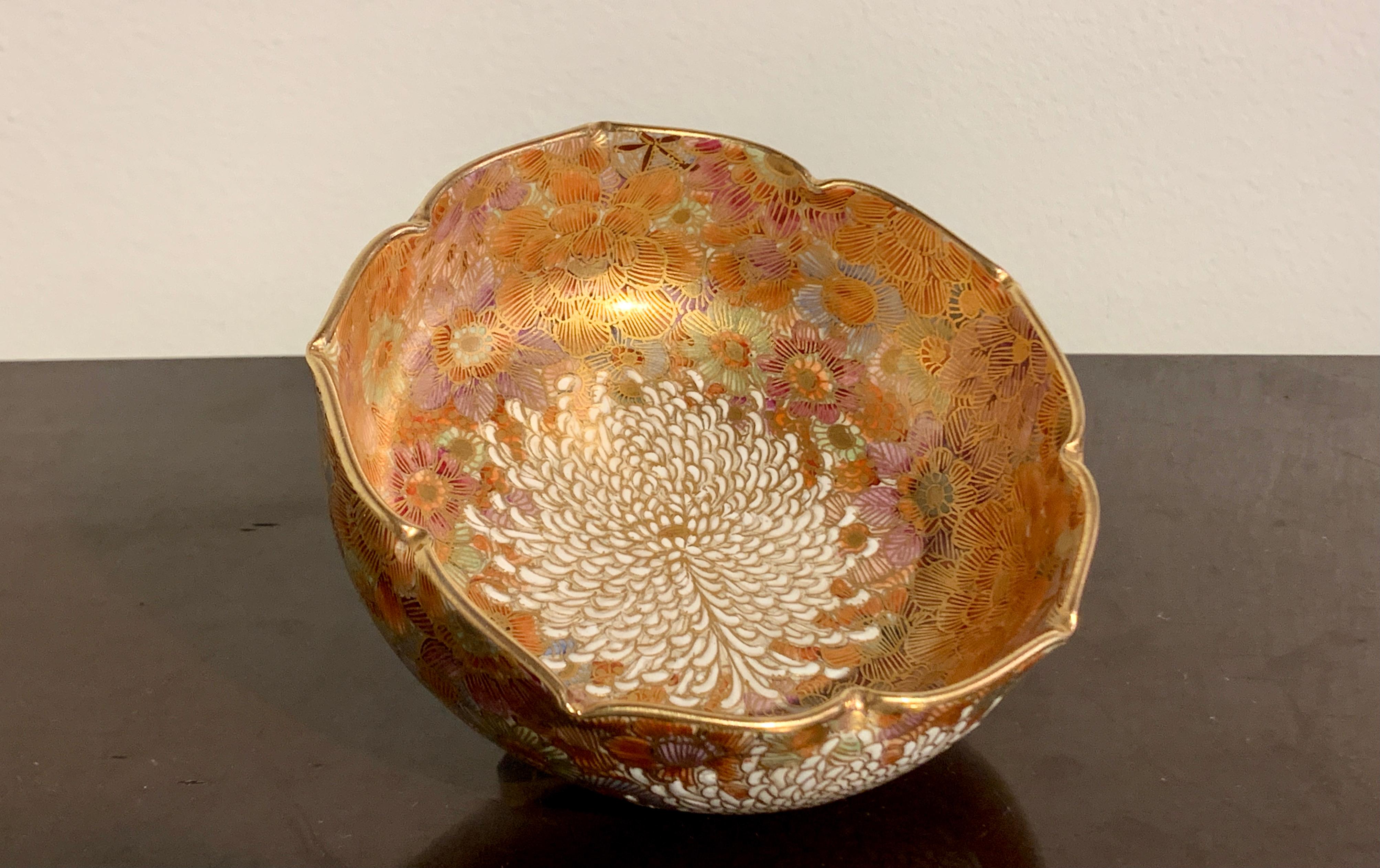 A fine and sumptuous Japanese Meiji period millefleur Satsuma moriage bowl by Shozan, circa 1900, Japan.

The shaped bowl of mallow form and decorated all over in a dense millefleur, or thousand flowers, design. A large chrysanthemum blossom in