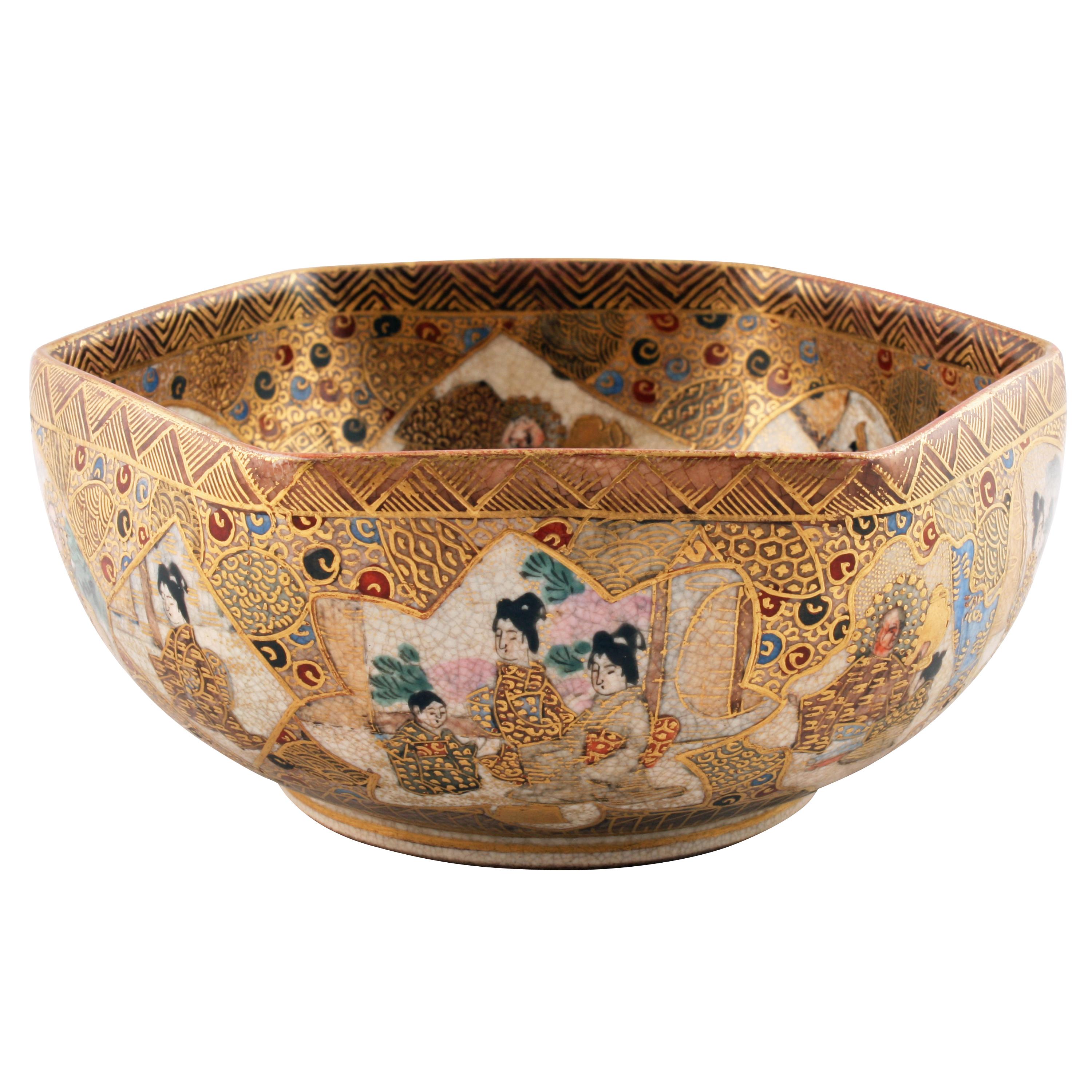 A late 19th century Japanese Satsuma pottery hexagonal shaped bowl by Shimazu, Meiji Period (1864-1912).


The bowl has a total of 15 hand painted panels inside and out depicting Japanese scenes of traditional dress (Bijin), Buddist monks (Kannon