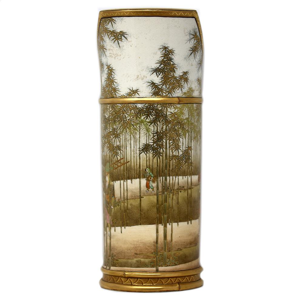 Japanese Meiji period satsuma sleeve vase by Hasegawa 長谷川作. The vase modelled as a single bamboo cane with simulated wood split to the top opening and ribbed section through the top third. The exterior decorated with a highly desirable continuous