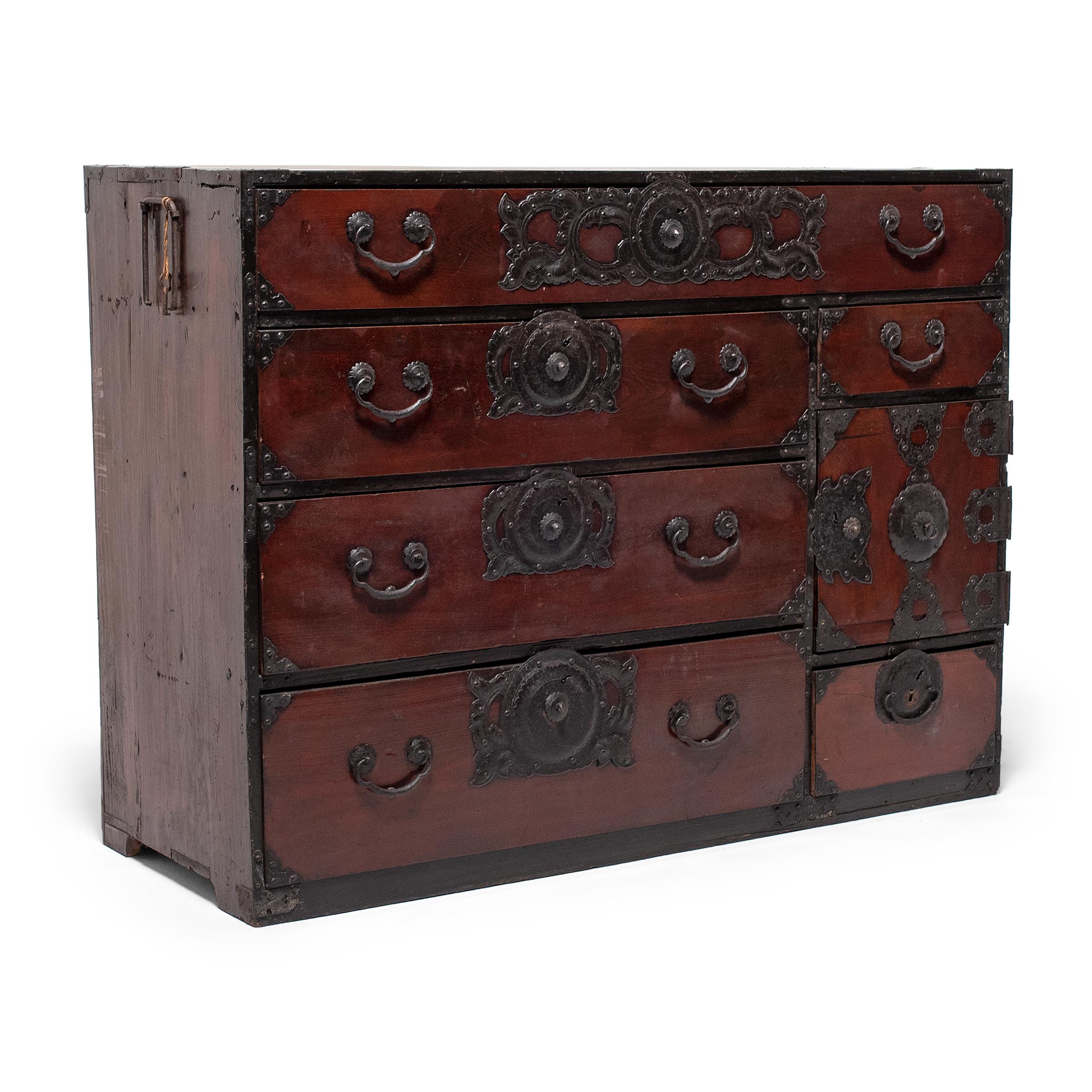 Designed to be versatile and portable, Japanese tansu chests were multipurpose storage cabinets that moved throughout the home as needed. This gorgeous example is a turn-of-the-century isho tansu (clothes chest), used for storing bedding and