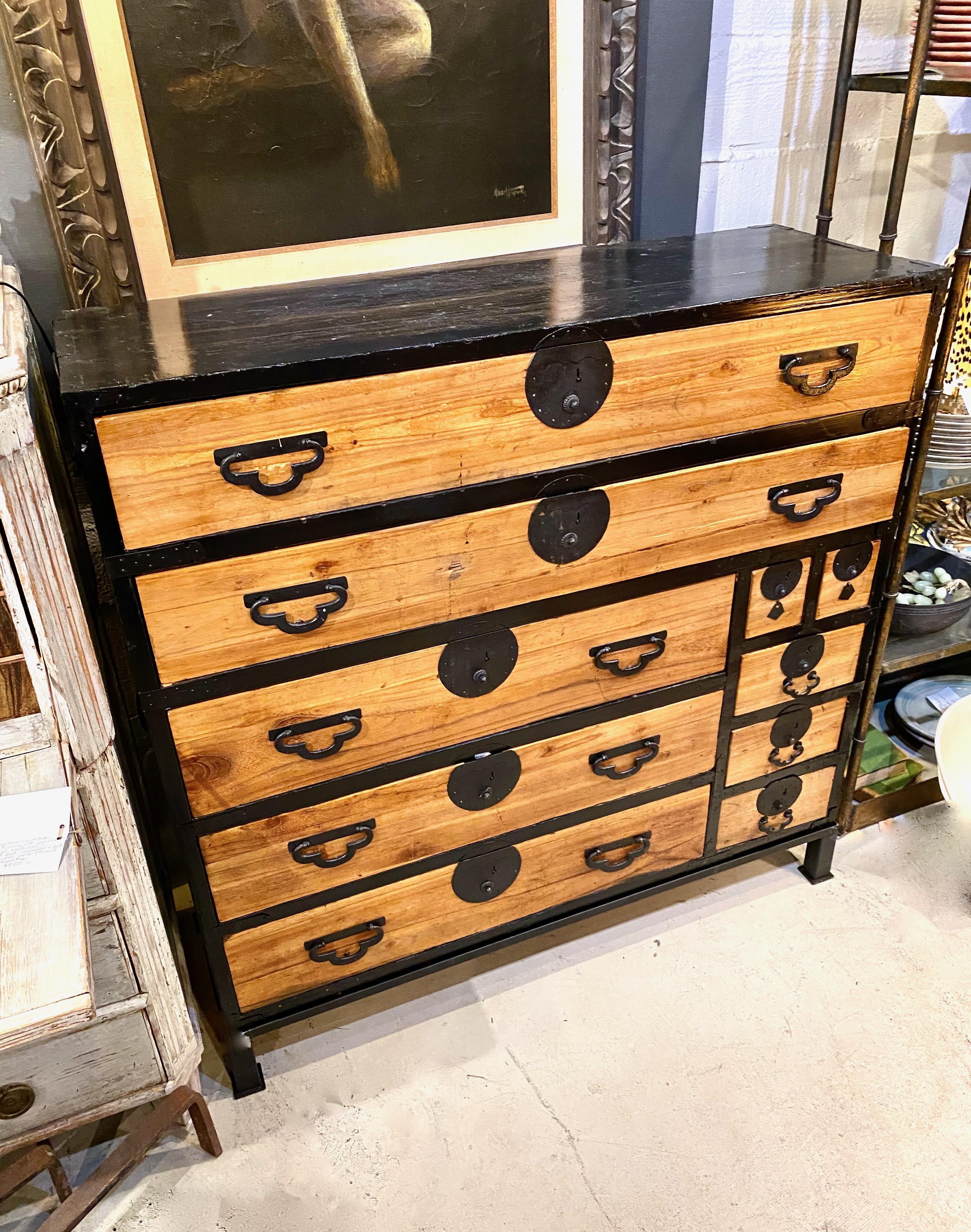This is a very graphic Meiji Period SendaiTansu that dates to the late 19th century. The arrangement of the drawers with highlighted black separations combined with the black sides and top remind me of Mondrian. This is a handsome one-part chest