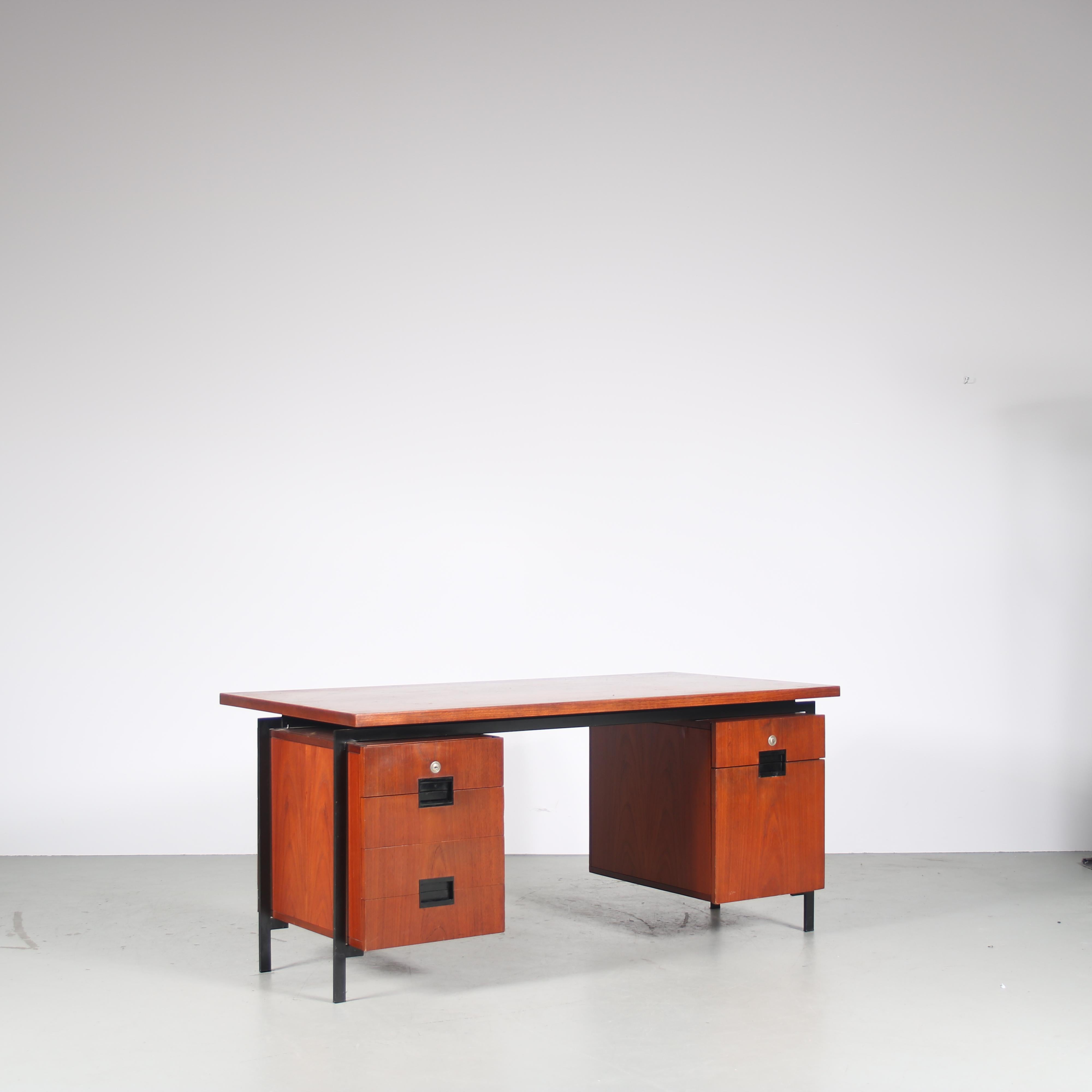 A beautiful Dutch design desk from the highly wanted Japanese Series designed by Cees Braakman, manufactured by Pastoe in the Netherlands, circa 1960.

This stunning desk is made of the highest quality teak wood on a black lacquered metal base. The