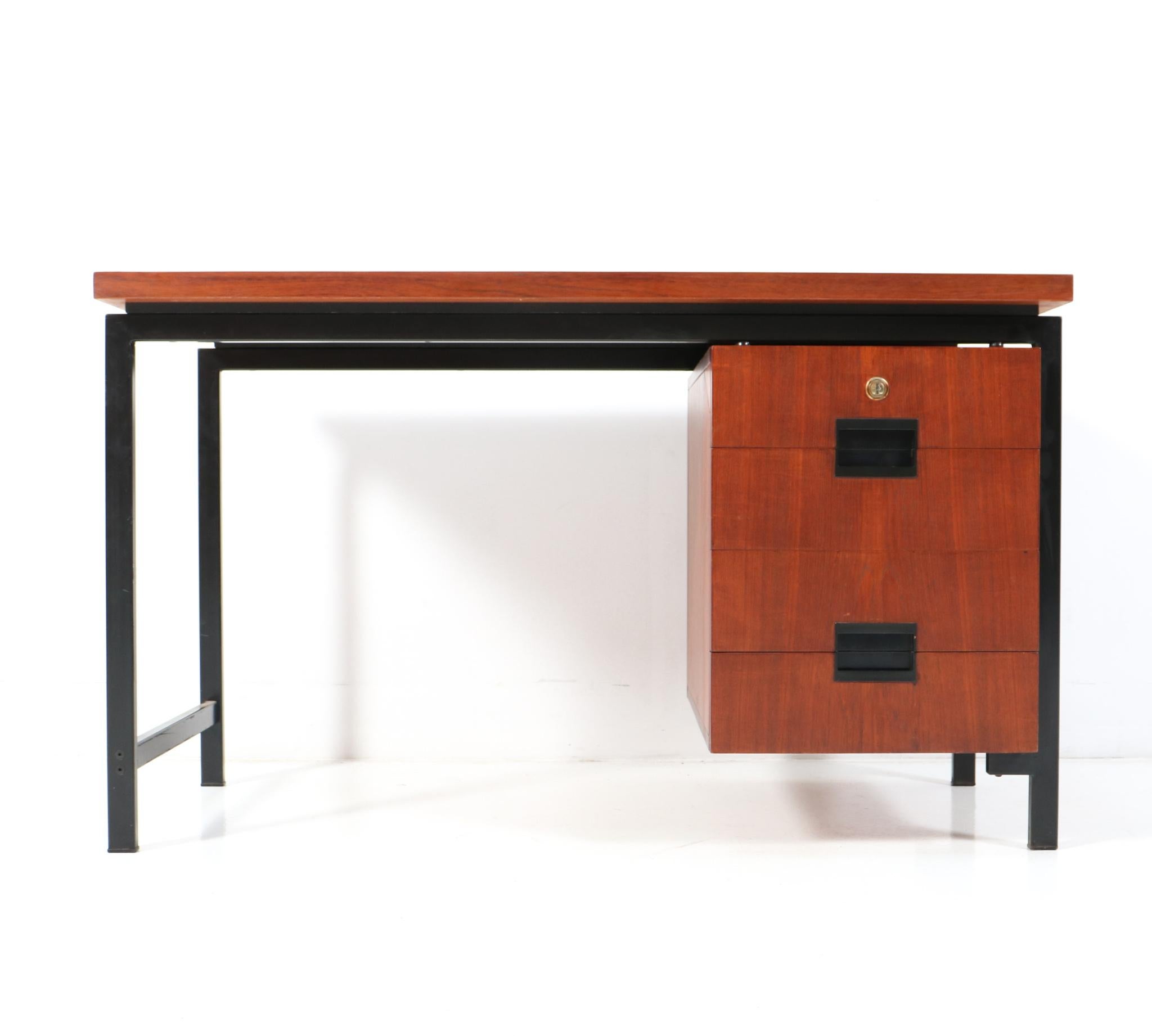 Petite and rare small Mid-Century Modern Japanese Series EU-01 desk.
Design by Cees Braakman for Pastoe.
Striking Dutch design from the 1950s.
Black lacquered metal frame with original teak veneered top and original teak veneered floating drawer