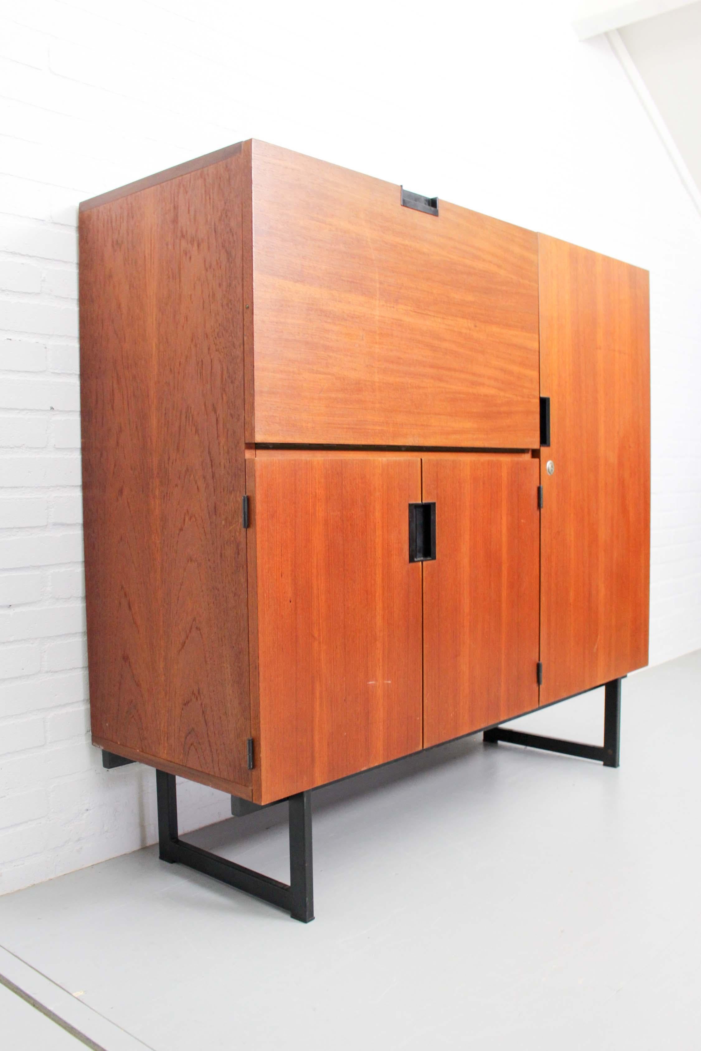 Dutch vintage design cabinet CU01 designed by Cees Braakman for Pastoe, 1958. This design from the Japanese series is one of the top pieces from Pastoe's history. The warm teak and the minimalist metal frame give it a modern look. The secretaire is