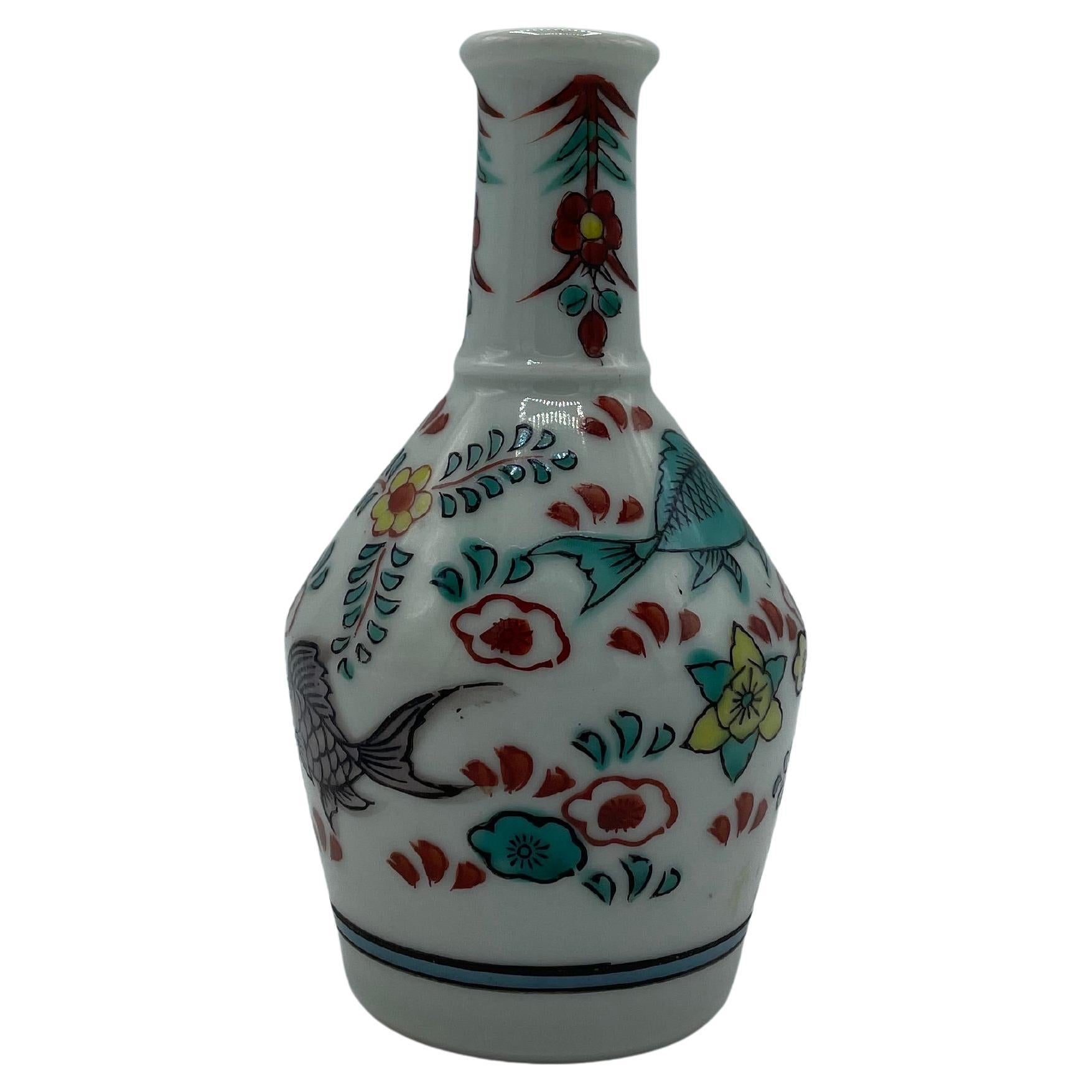 This is a sake bottle which was made in Japan around 1990s in Showa era.
This sake bottle is called Tokkuri in Japanese.
The design is hand painted.

This bottle can be used as a flower vase.
