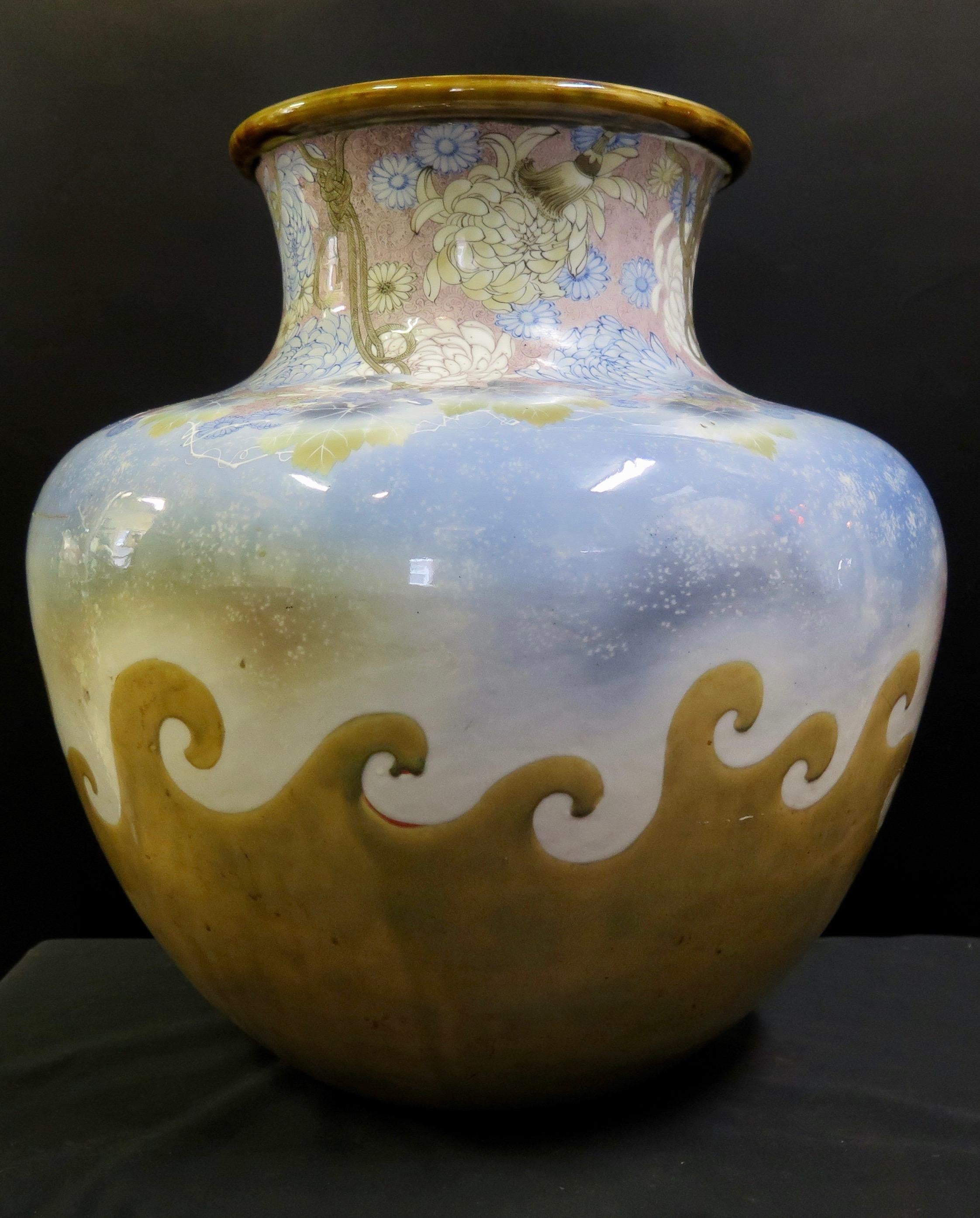 This wonderful vintage Japanese Seto porcelain ware jar decorated with color under-the-glaze. The stamped mark on the base is Kawamoto Masukichi II (1852-1918) the vase is designed in subtle blue, mauve, okra and white colorations highlighting the