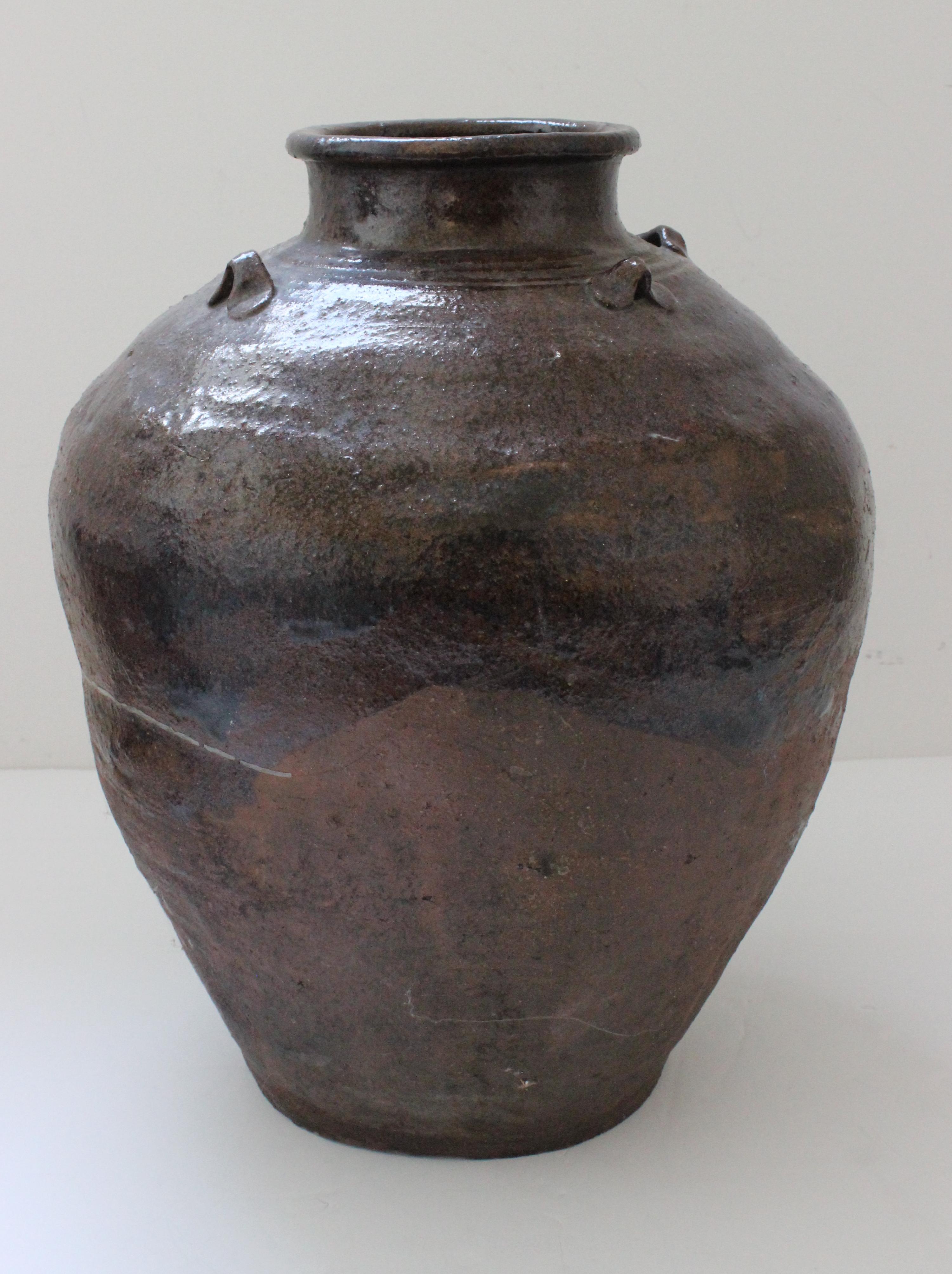 This Japanese, Seto stoneware tea jar dates to the 17th century and was acquired from an estate in Portland, OR. The dark brown iron glaze was known as tenmoku wares. 

Note: We are describing the jar as such based on what the previous owner has