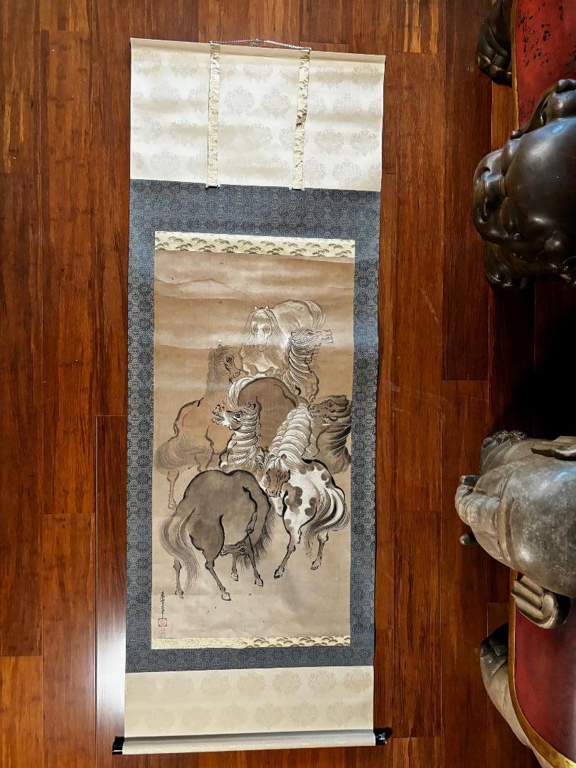 Japan, a stunning scroll depiction of seven (7) horses entwined in a creative circle .  Hand painted - an auspicious art composition rendered on paper and silk backing and  dating to the Showa period.

This 20th century piece would look fitting for
