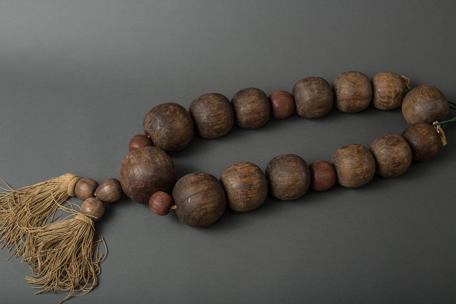 Large sculpture of prayer beads used as a shop sign. Can be displayed flat or hung on a wall.