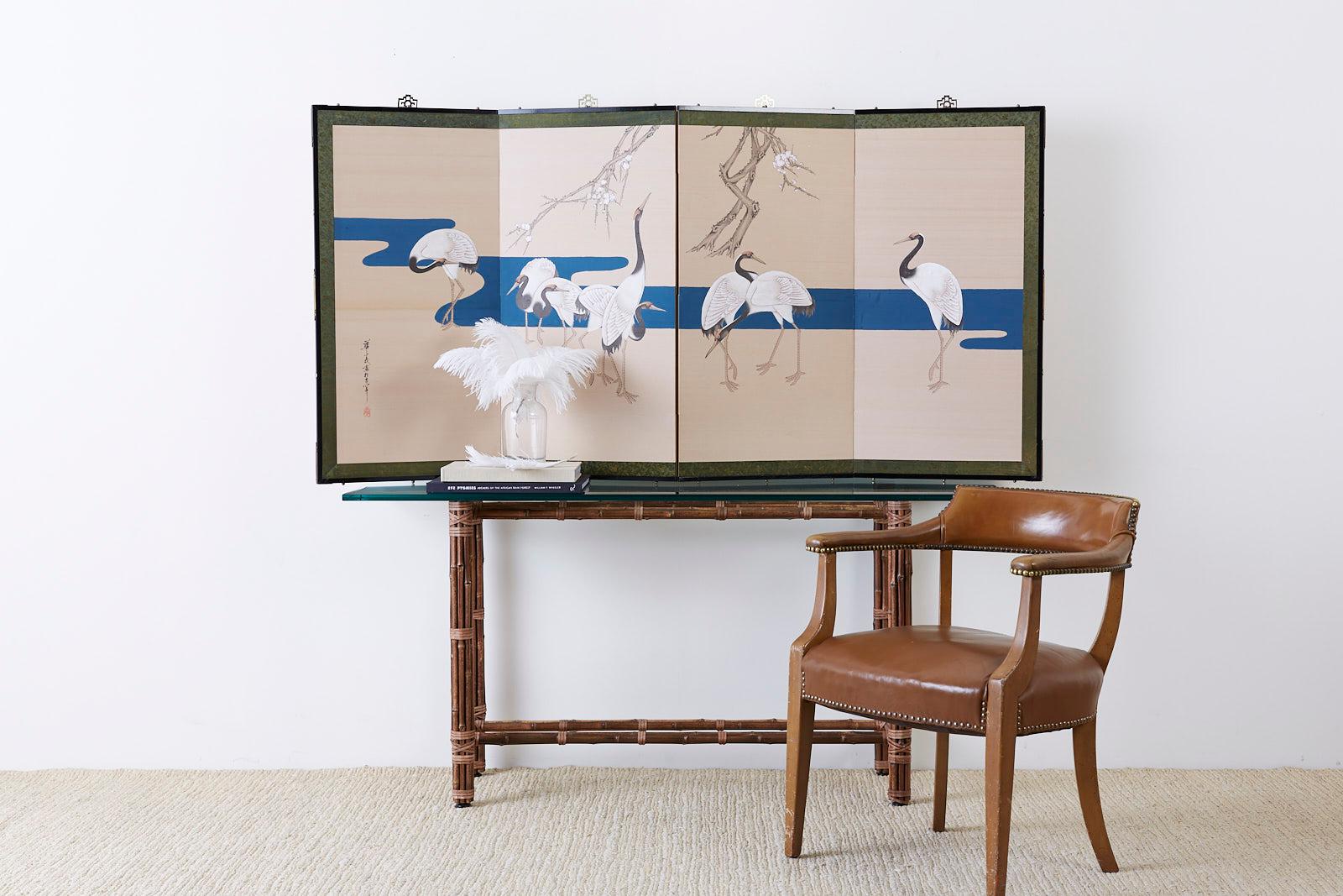 Fantastic Japanese Showa period four-panel byobu screen featuring eight red crowned Japanese cranes or Manchurian cranes. Painted in a modern Rinpa School style with a dramatic effect of bold colored pigments over a gold silk background. A deep