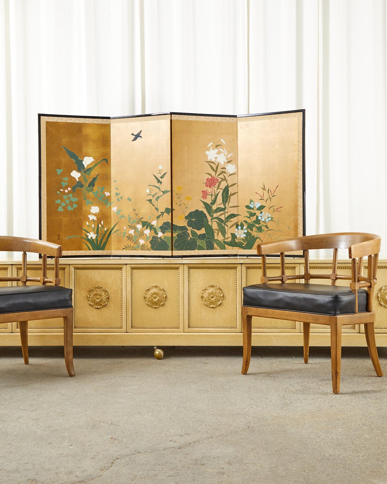 Charming Japanese Showa period four-panel byobu screen depicting a songbird in flight above blossoming spring flowers. Ink and natural color pigments on a gilt square background. Signed with a seal on left bottom side. Set in an ebonized wood frame