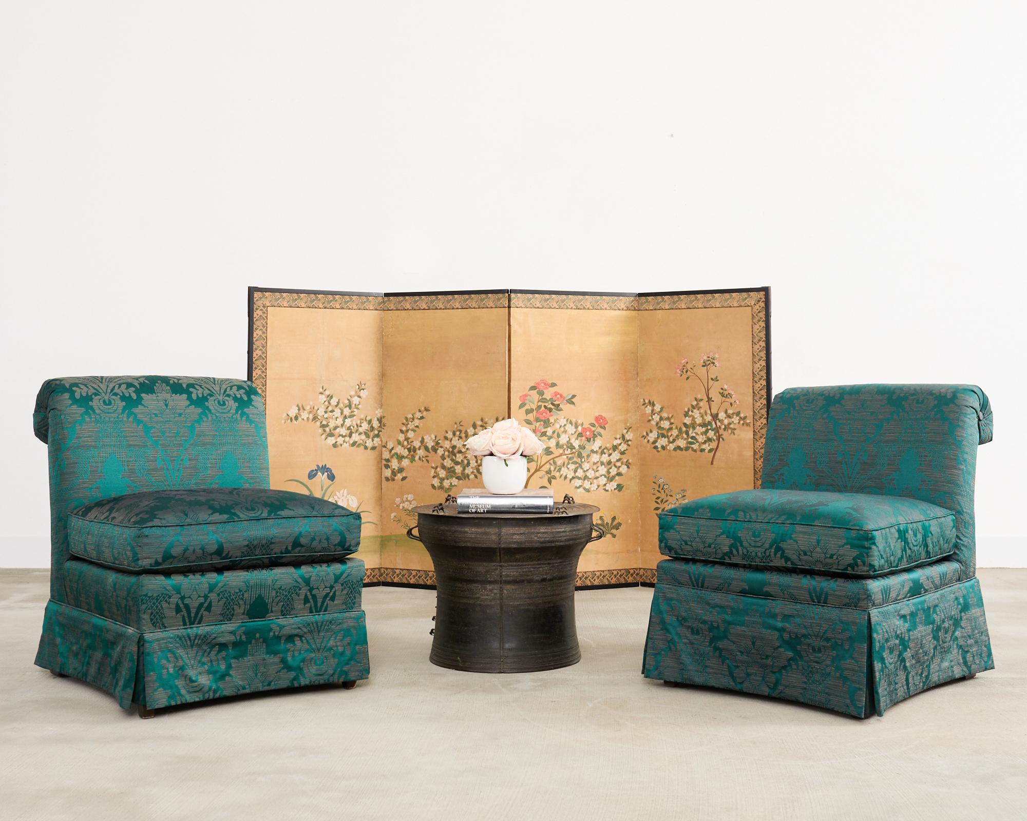 Charming mid-20th century Japanese Showa period four-panel folding byobu screen featuring blossoming spring flowers over a bold gilt background. The painting depicts iris, camella, wild pinks, dandelion, and daisy with delicate and intricate
