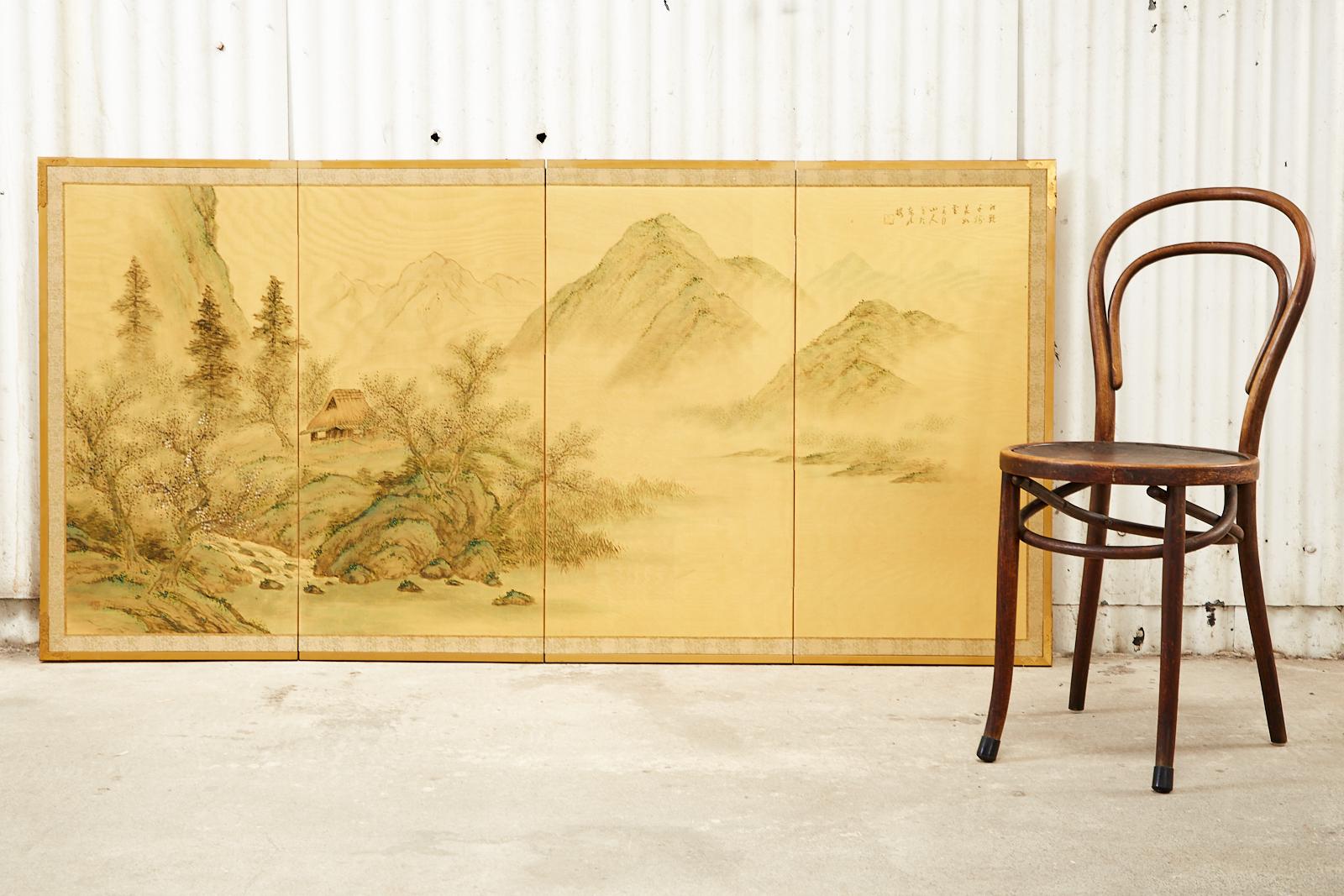 Distinctive Japanese Showa period four-panel byobu landscape screen depicting a spring mountain scene. Made in the Nihonga school style. Ink and natural color pigments painted on gilt silk and set in a giltwood frame with a silk border. Inscribed