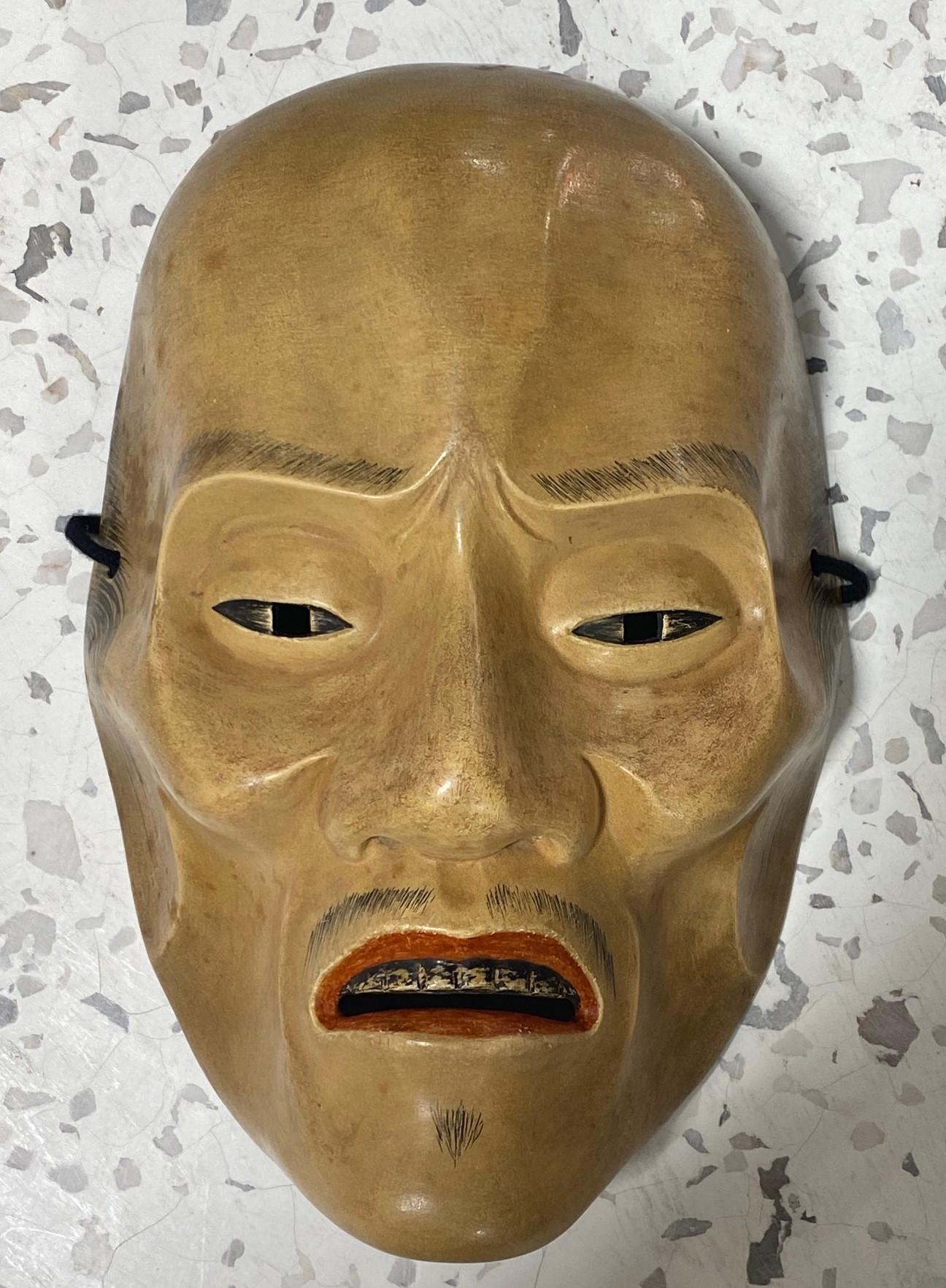 A beautifully carved, wonderfully crafted, highly engaging mask made for Japanese Noh theatre.

The mask is handcrafted and hand carved from natural cypress wood clearly by a master of his Craft (the Japanese artifacts collector we acquired this