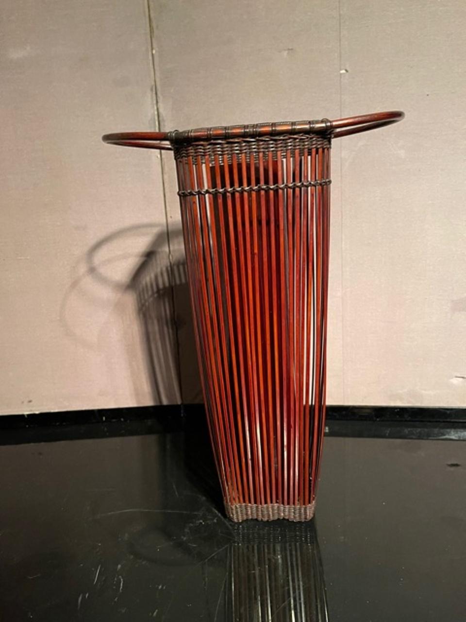 Japanese bamboo ikebana basket made during the Showa period, circa 1930. In great vintage condition with age-appropriate wear.