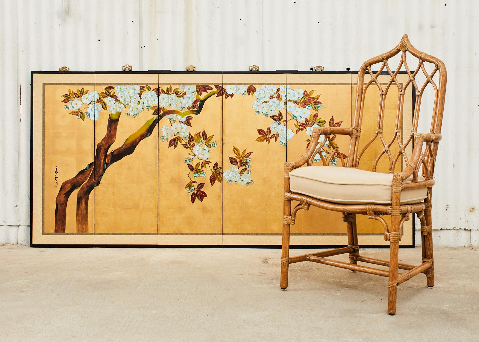 Stunning Japanese late Showa period Nihonga School six-panel byobu screen featuring a spring flowering cherry tree with white blossoms. The screen is signed Shugetsu and sealed by Raku by artist with a cyclical date. Dramatic background of gilt gold