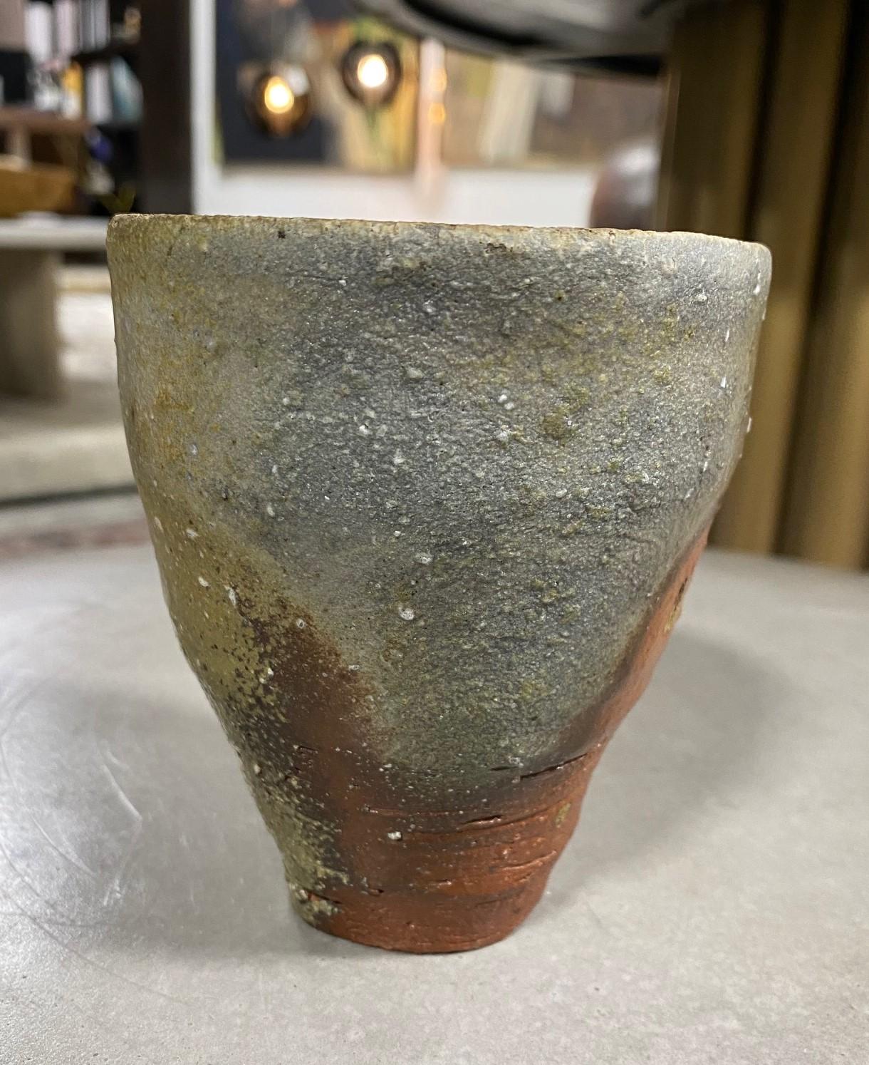 A wonderful gem of a piece. Beautifully fired and colored and featuring a natural, organic ash glaze. 

Japanese Bizen-Yaki pottery which dates back hundreds of years (its heyday was in the 16th century) is recognizable by its rustic quality and