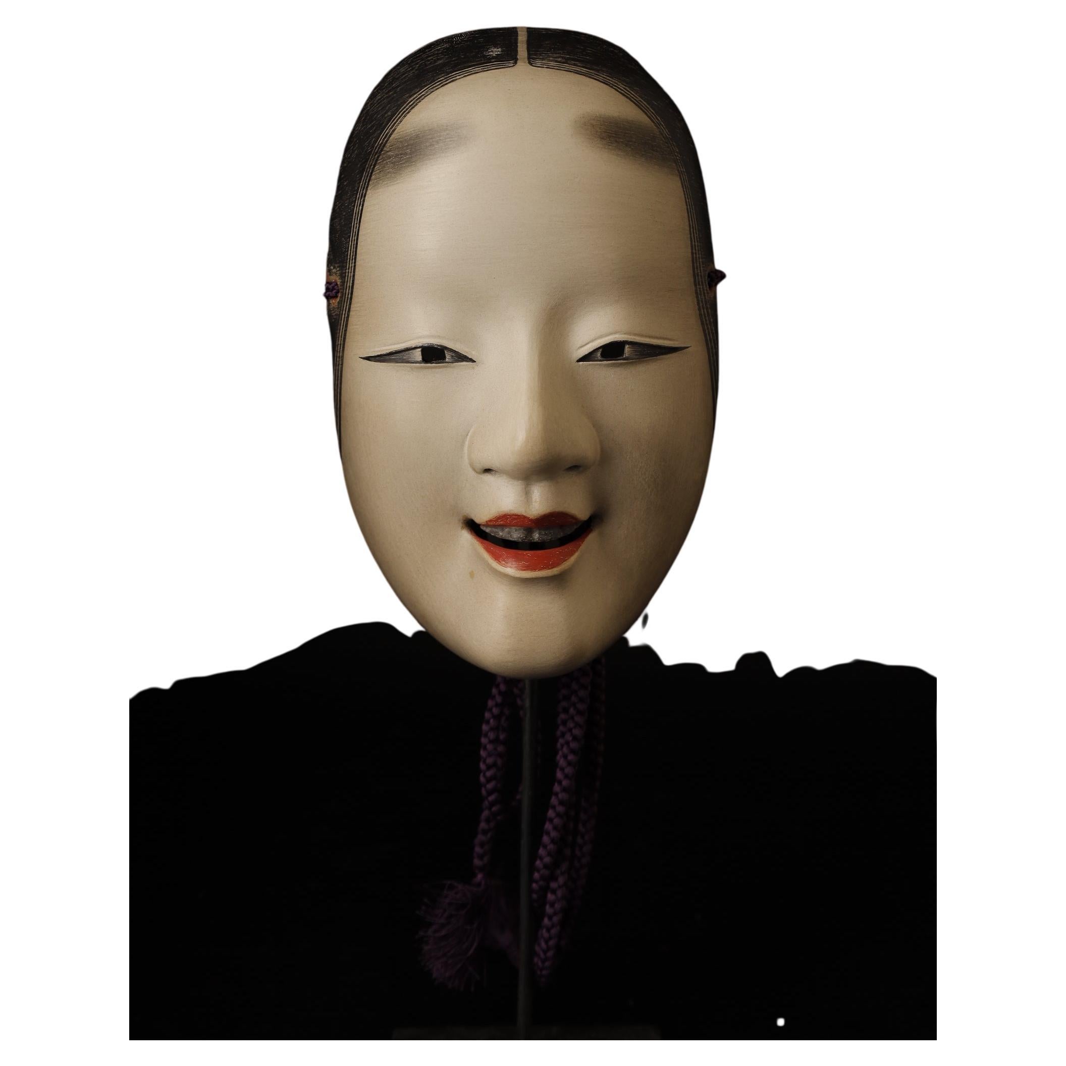 Very High-Quality Noh Mask Depicting Koomote Character of a Young Woman

This very high-quality Noh mask depicts the Koomote character of a young woman who is not yet twenty. It was carved by master carver Nomura Ran, who is known for his fine masks