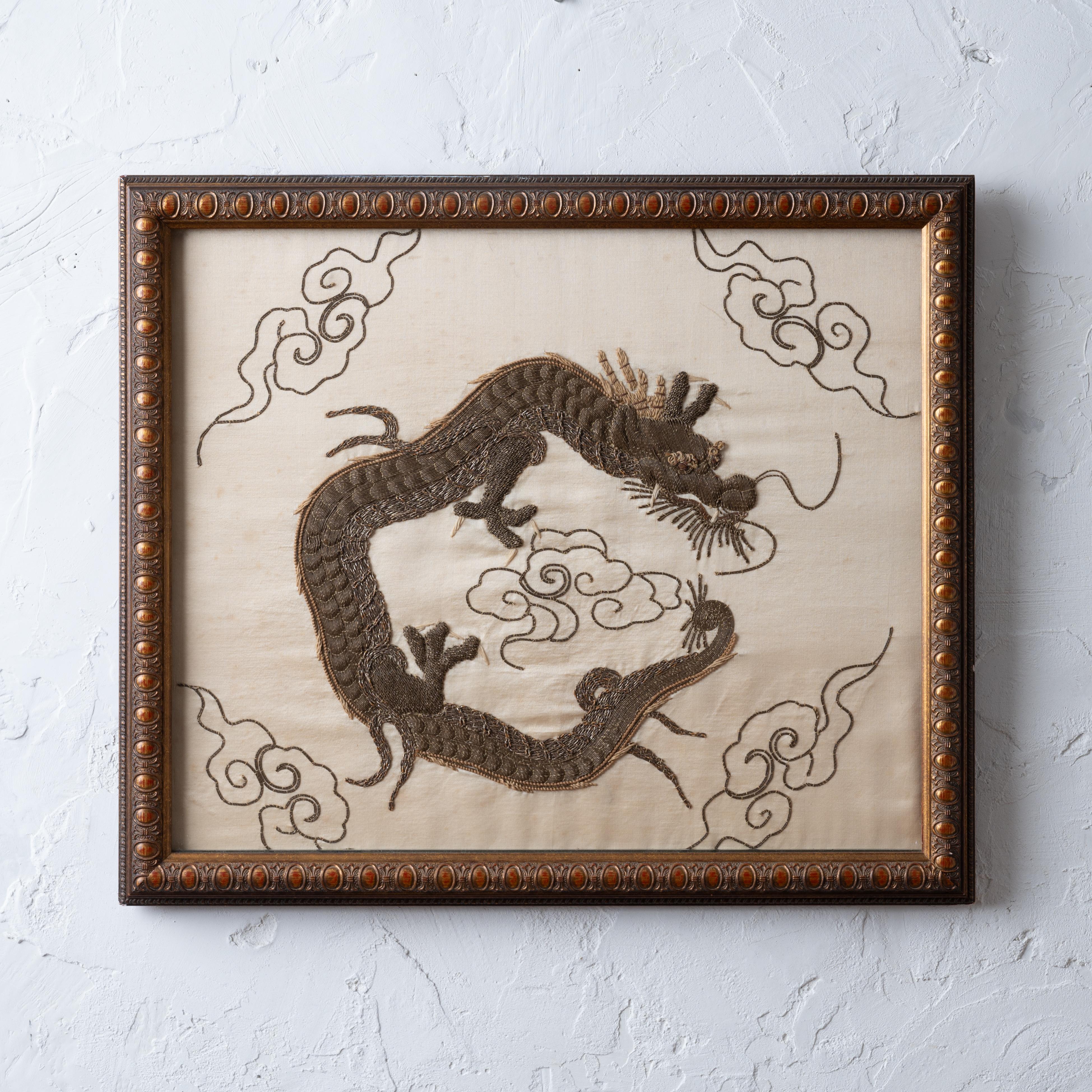 A Japanese silk dragon embroidery in high relief, late 19th century.

23 ½ by 20 inches

