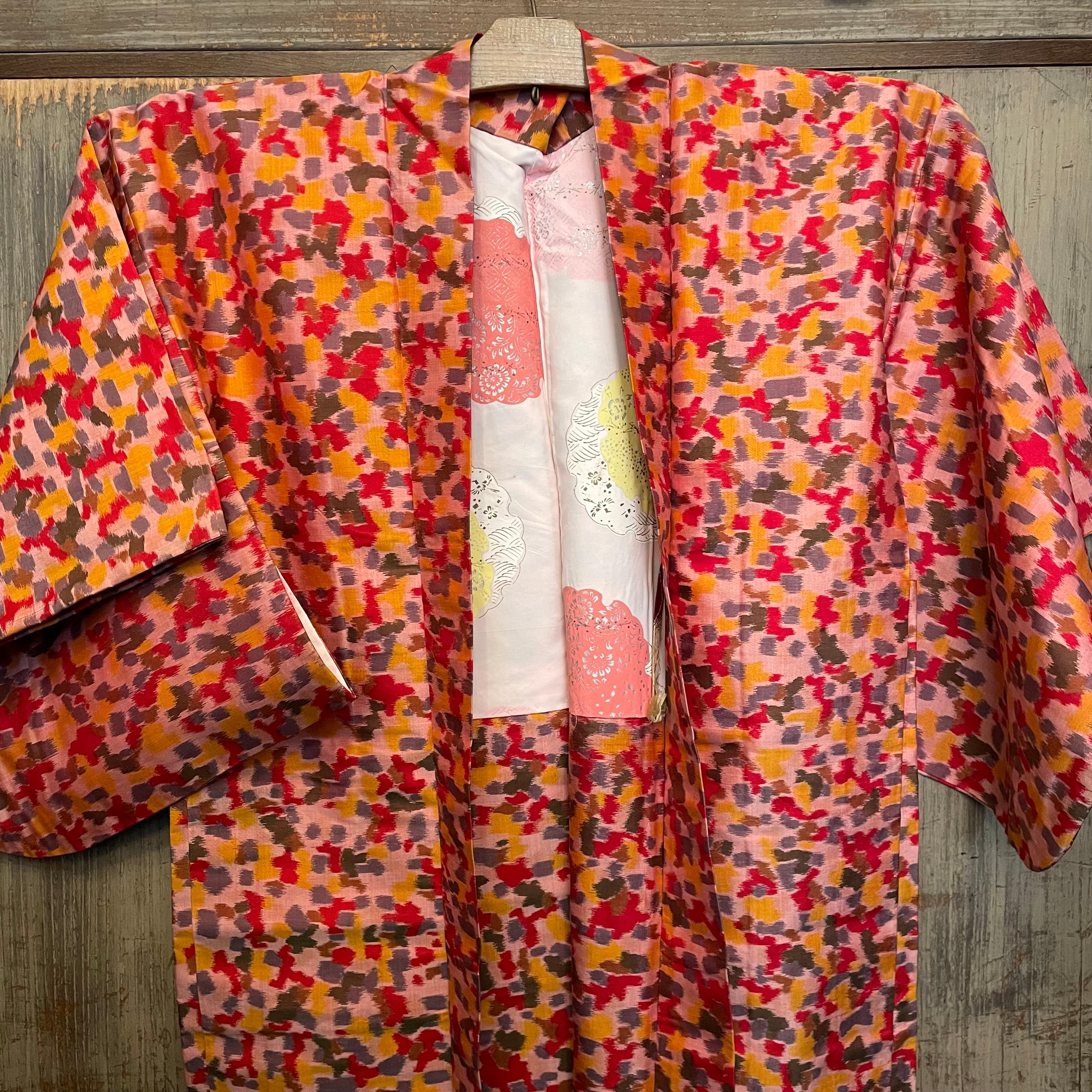 This is a silk jacket which was made in Japan.
It was made in Showa era around 1980s.

The haori is a traditional Japanese hip- or thigh-length jacket worn over a kimono. Resembling a shortened kimono with no overlapping front panels (okumi), the
