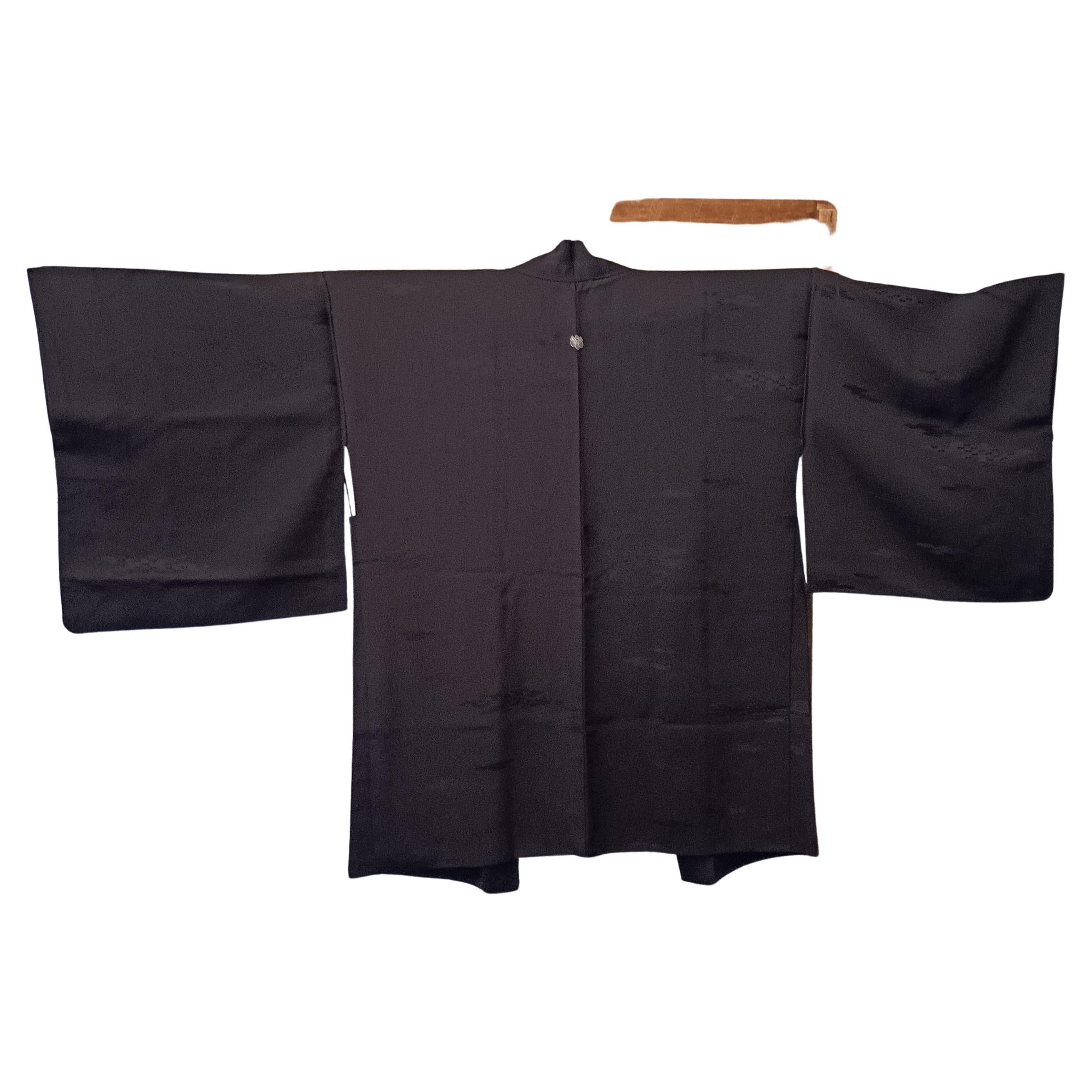 This is a silk jacket which was made in Japan.
It was made in Showa era around 1980s.

The haori is a traditional Japanese hip- or thigh-length jacket worn over a kimono. Resembling a shortened kimono with no overlapping front panels (okumi), the