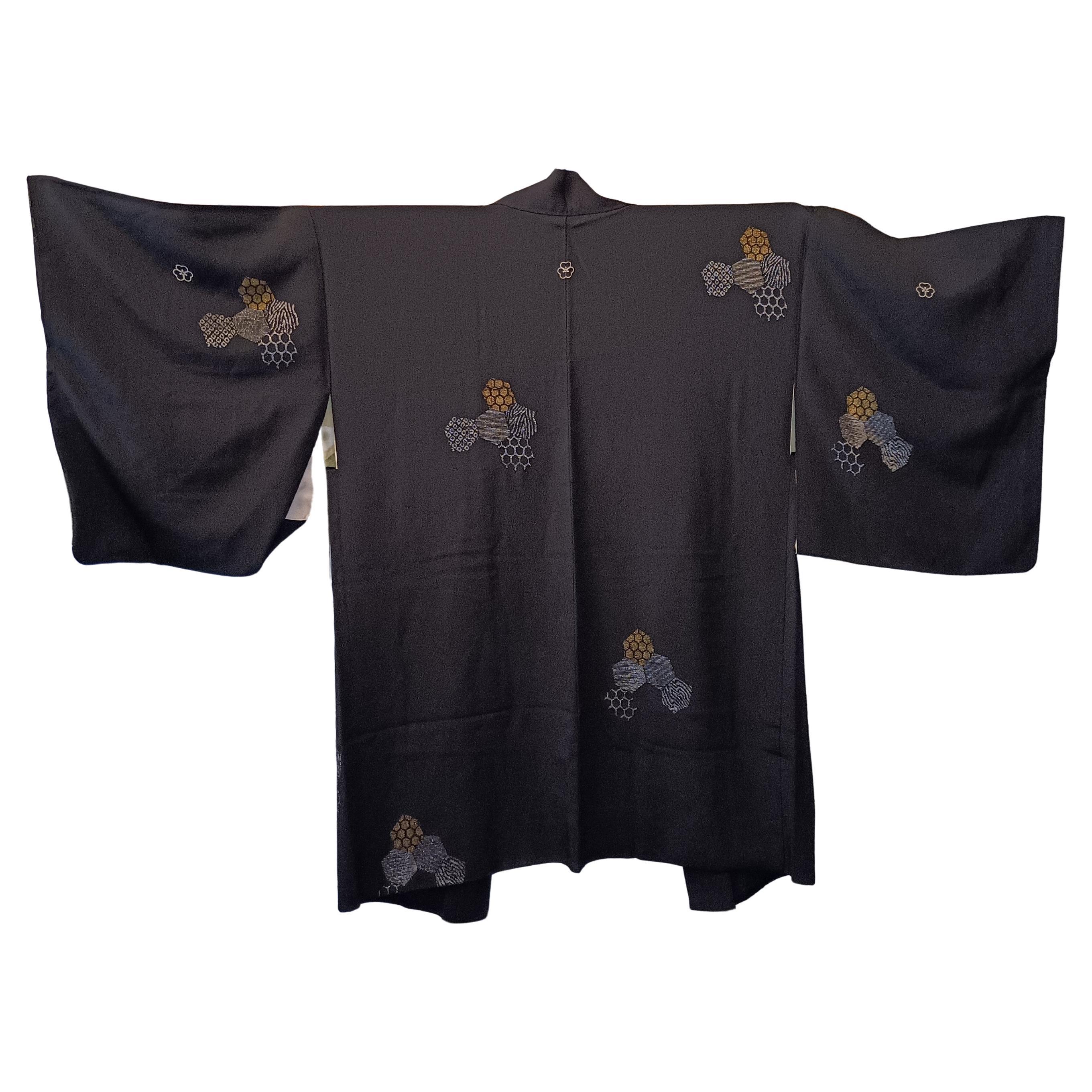 This is a silk jacket which was made in Japan.
It was made in Showa era around 1980s.

The haori is a traditional Japanese hip- or thigh-length jacket worn over a kimono. Resembling a shortened kimono with no overlapping front panels (okumi), the