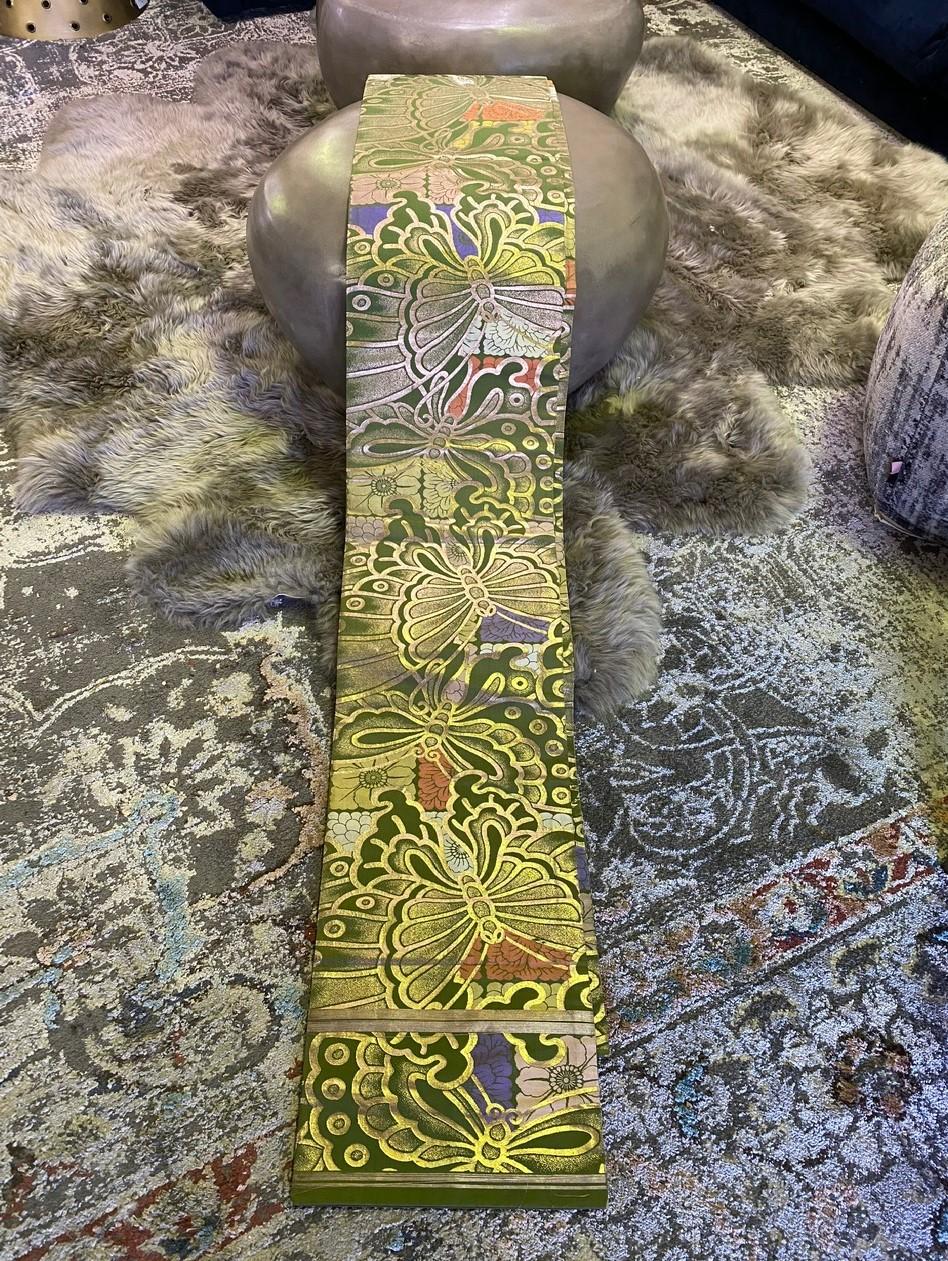 A wonderful handmade vintage silk Obi sash/ belt featuring a very colorful butterfly and nature motif. Very intricately made and detailed and handwoven with gold thread. 

Would be a fantastic addition to any collection or stand-alone accent piece