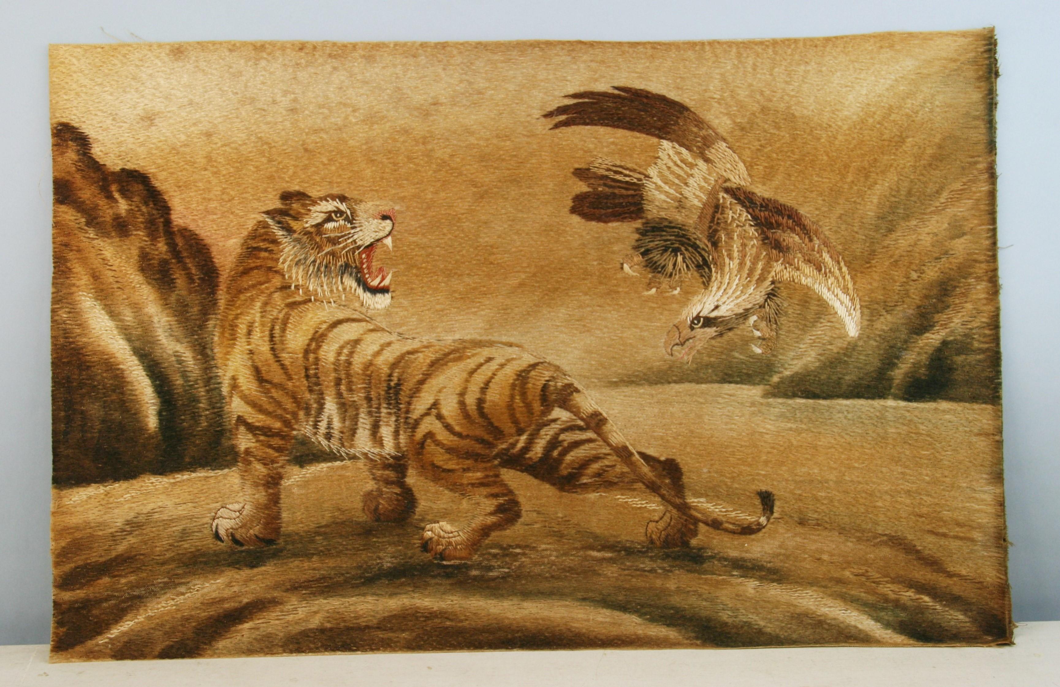 Japanese Hand embroidered wall hanging   of the Tiger and Eagle early 2oth century.
Woven in shades of brown,gold,yellow and red silk and cotton with a tiger and an eagle.
Beautiful full color tones across the piece.
Applied to a board at latter