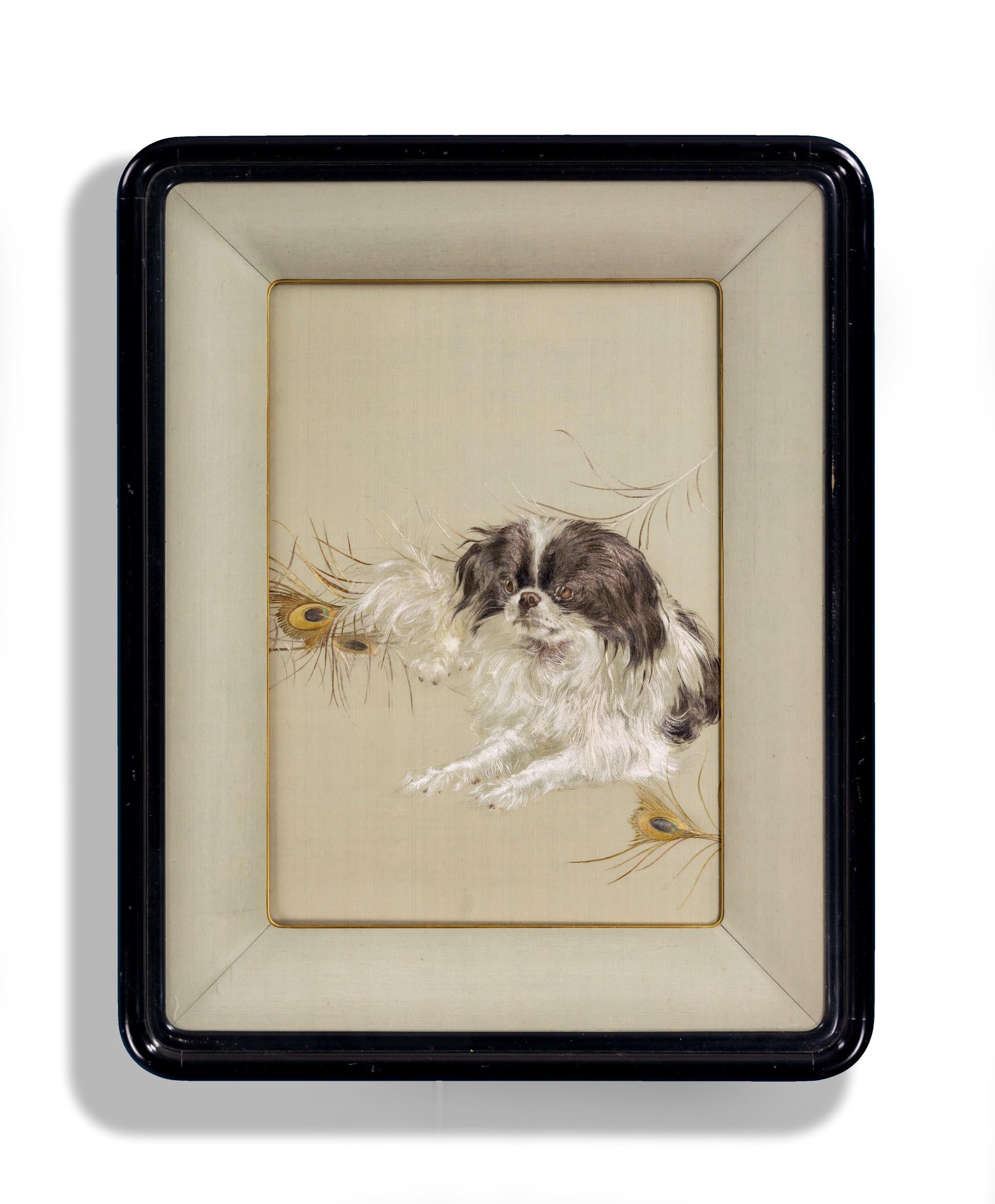 As part of our Japanese works of art collection we are delighted to offer this charming Meiji period 1868-1912 embroidery of a chin dog aside a spray of peacock feathers and by one of the most famous textile company’s of the period, the Iida