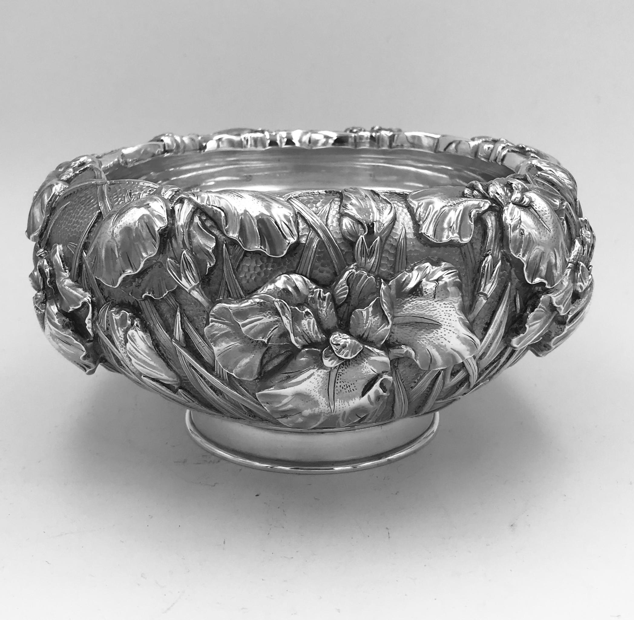 A Meiji period Japanese silver bowl with extremely detailed iris decoration and of typical double-skin form. The bowl dates form circa 1895 and was made by Katsuzo Mune, and their mark appears on the underside of the base of the bowl alongside the
