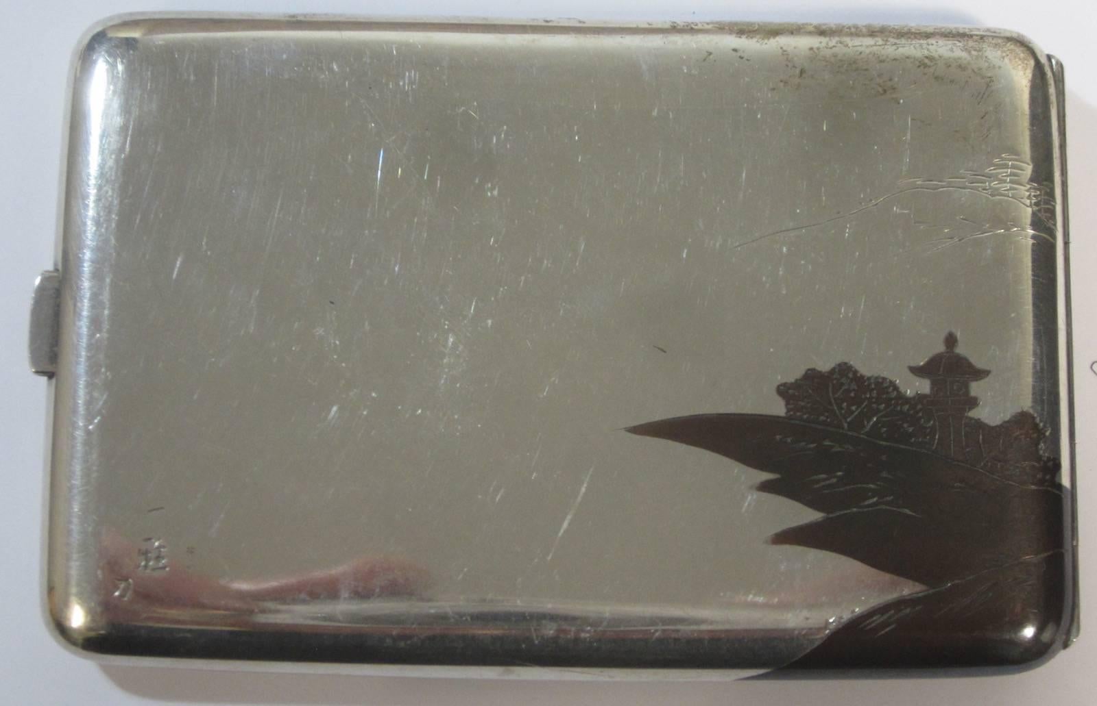 Japanese silver cigarette case,
with internal decoration,
marked SILVER 950,
144 grams, 5.1 ounces.