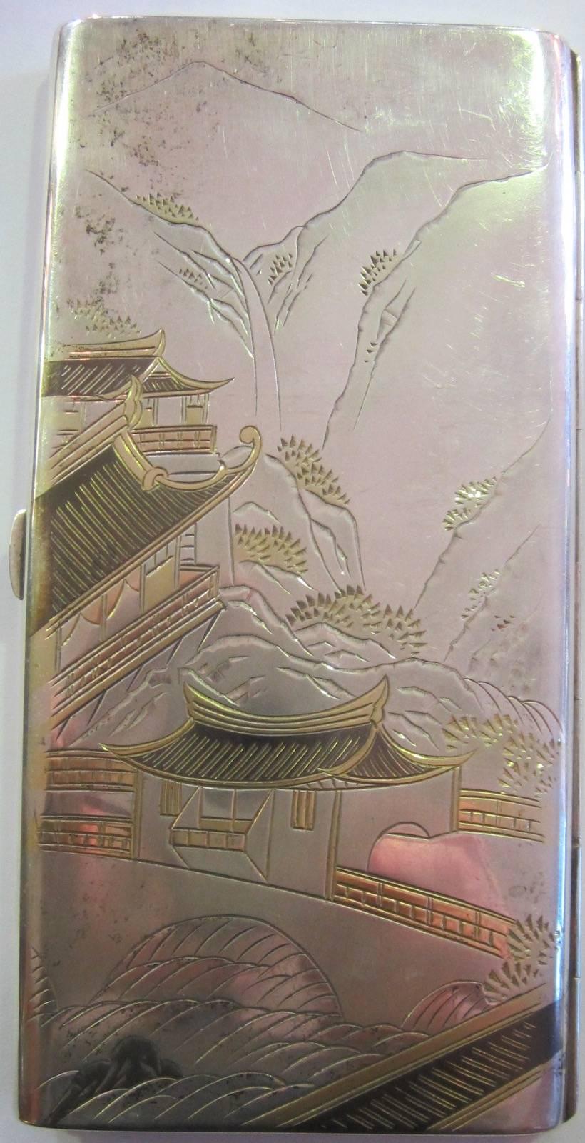 Japanese silver cigarette case,
marked STERLING SILVER 950,
187 grams, 6.6 ounces.