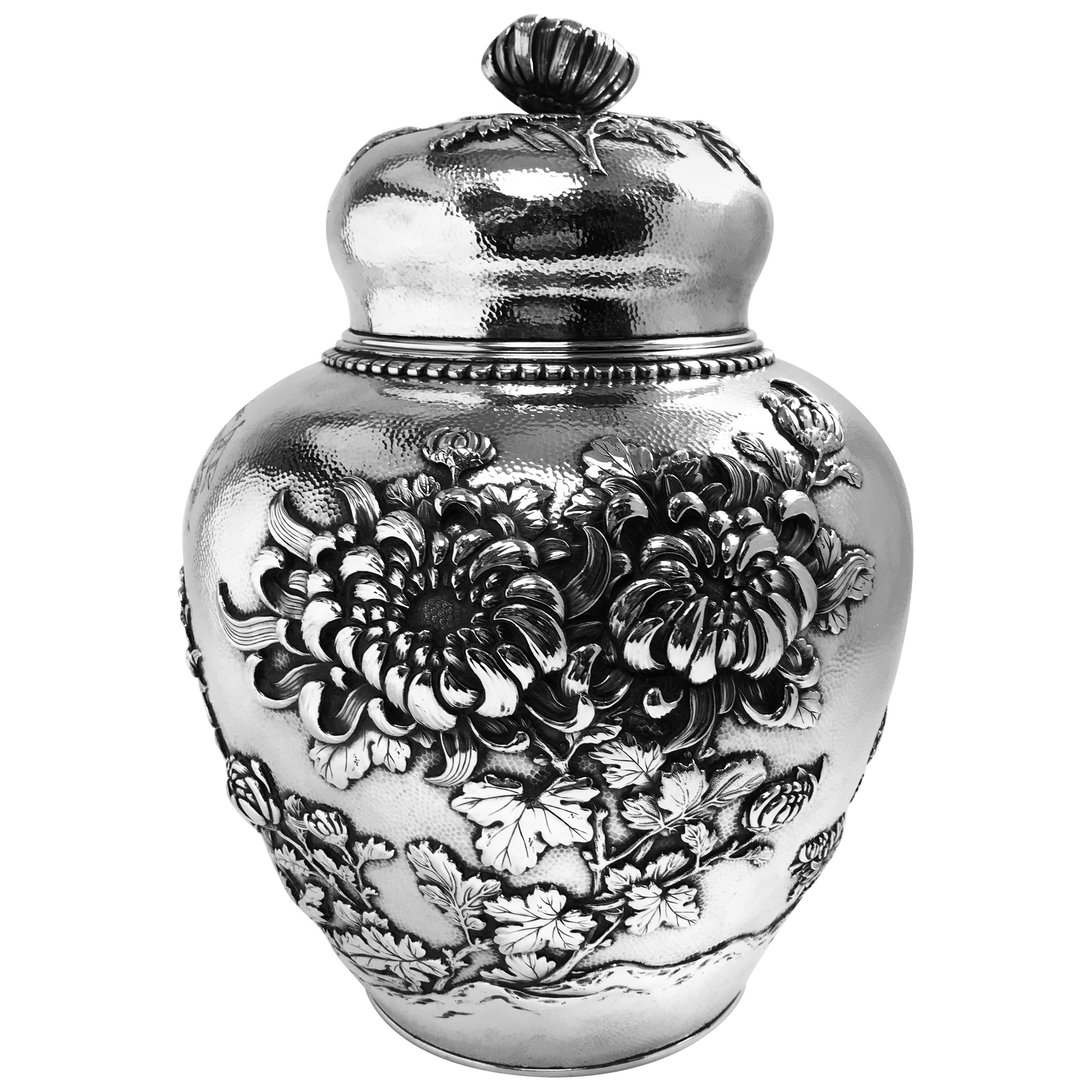 A large and important silver ginger jar made in Japan in the late Meiji period. It was sold in the port of Yokohama and the engraved inscription to one side indicates that it was bought as a gift from the officers and crew of the yacht Alcedo to the