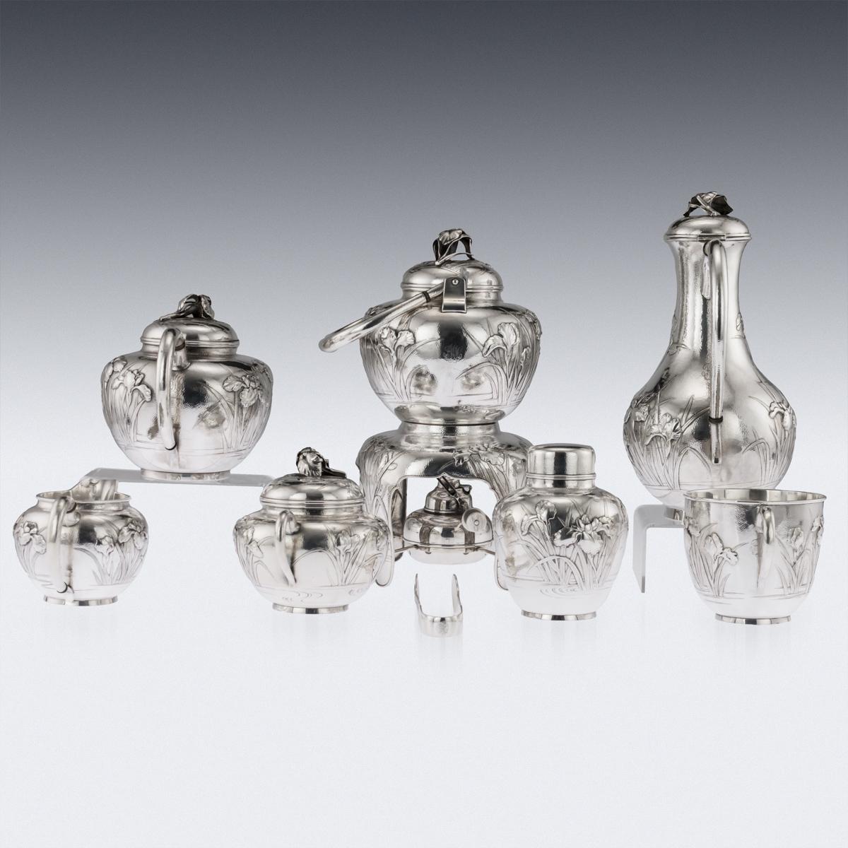 Antique early 20th century Japanese solid silver massive eight-piece tea & coffee service on tray, exceptional and magnificent quality, double walled, embossed and applied with Iris flowers in high relief, with elegant C-form handles and lids