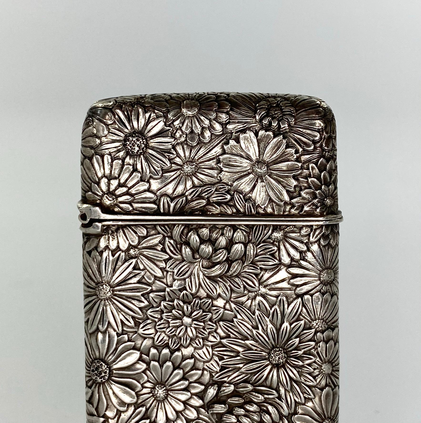 Japanese solid silver vesta, circa 1890, Meiji period. The small vesta cast with a profusion of flower heads, to both the case, and the cover.
Striker to the base.
Weight 22 grammes.
Medium: Silver
Measures: Height 5.5 cm, 2 1/8”.
Width 3.3 cm,