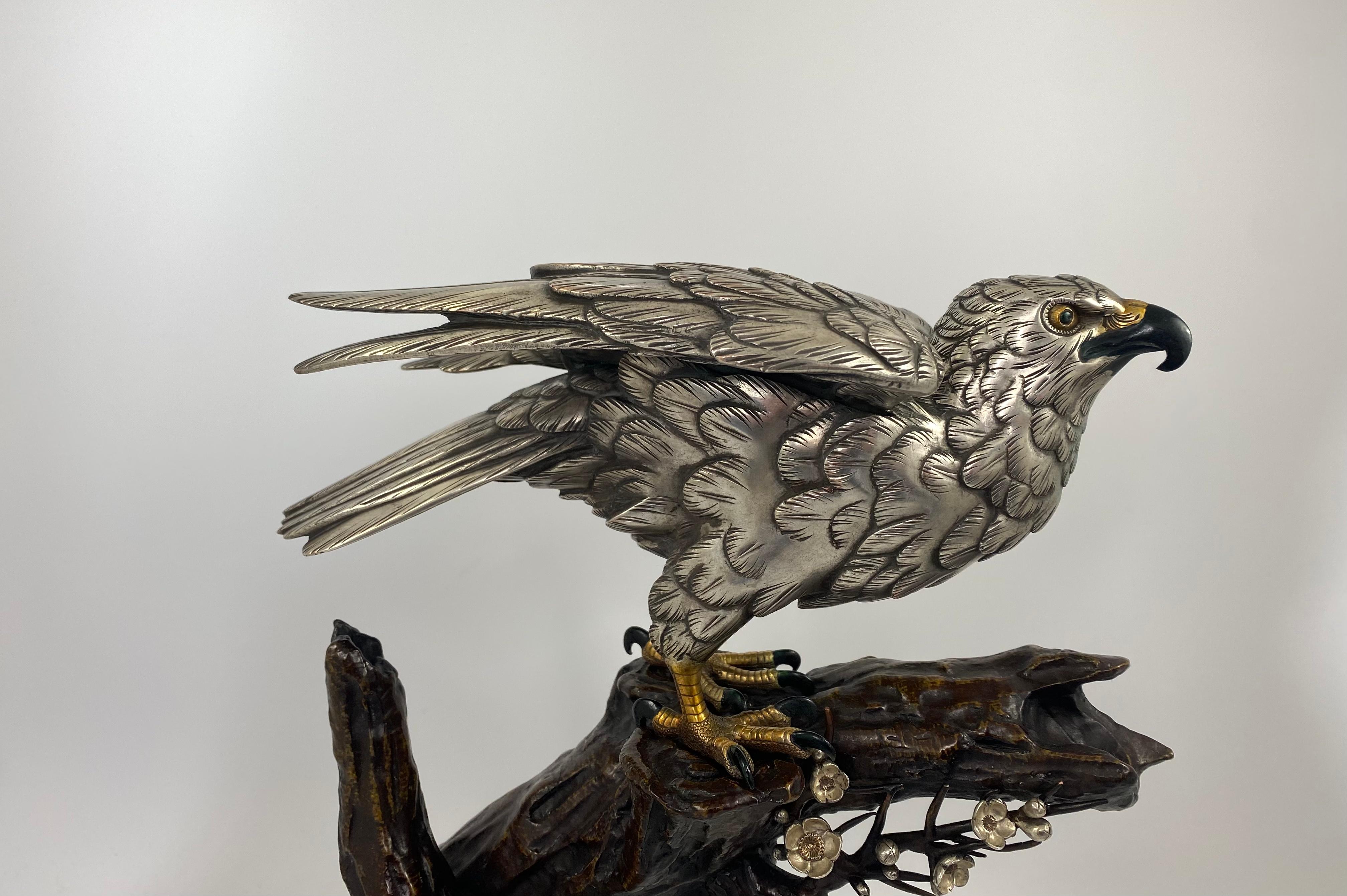 A fine Japanese silvered bronze okimono of a Sea Eagle, Genryusai Seiya, Meiji Period. Beautifully modelled, readying himself to attack his prey, with an alert expression and his wings slightly raised. His body and feathers silvered, whilst his eyes
