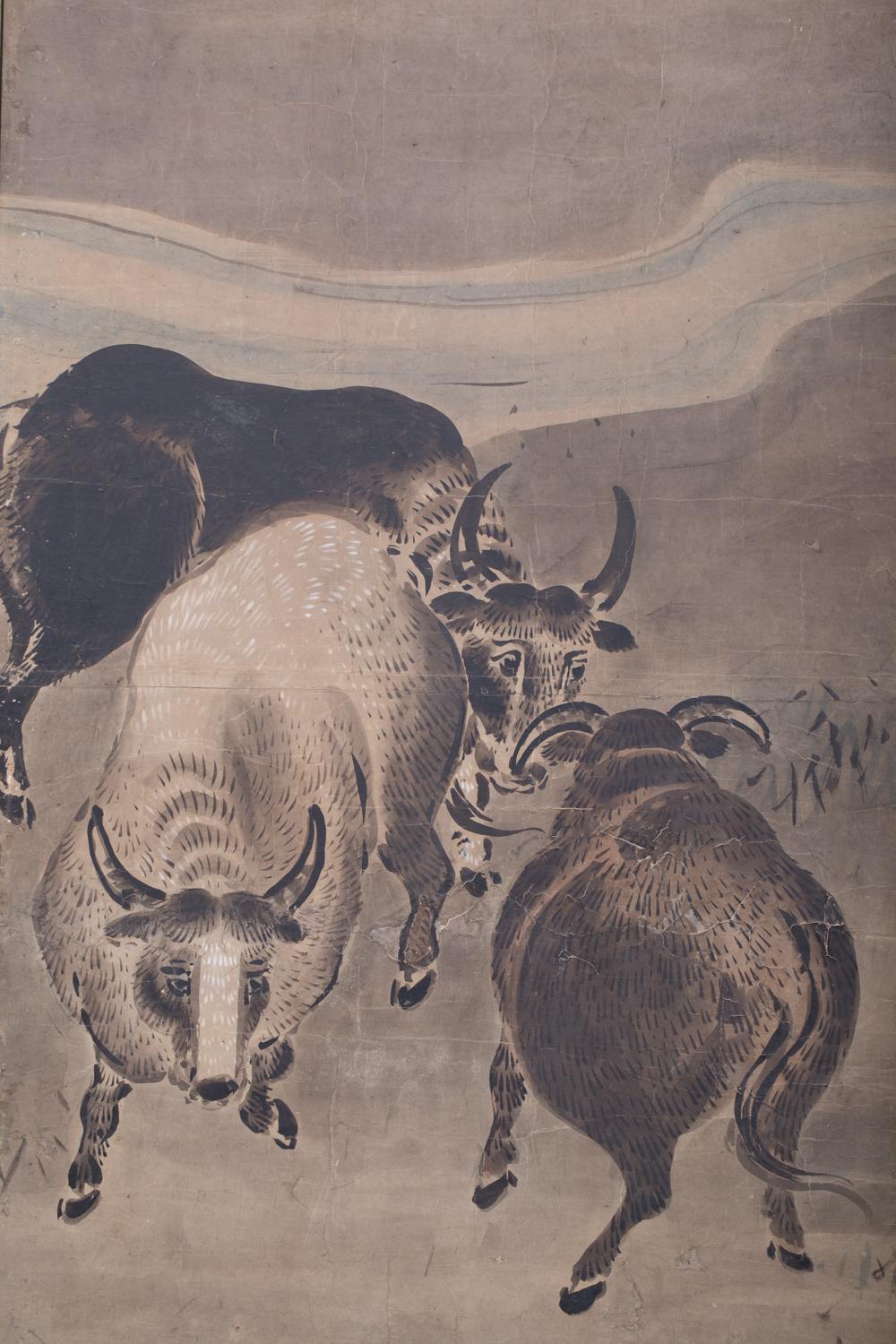 Sumi (ink) painting of bulls next to a stream with minimal colors on mulberry paper with silk brocade border.
 