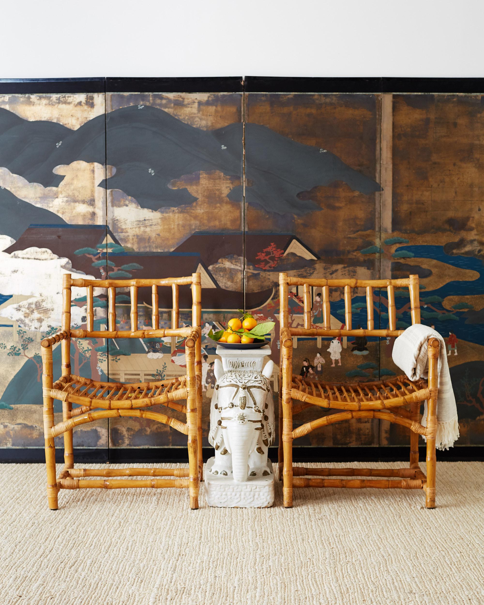 Edo period style Japanese six-panel byobu screen depicting aristocrats in a Heian period setting. Painted in the Tosa school style with large opaque mountains and river landscape over a gold leaf background. Figures amid pagodas and trees with