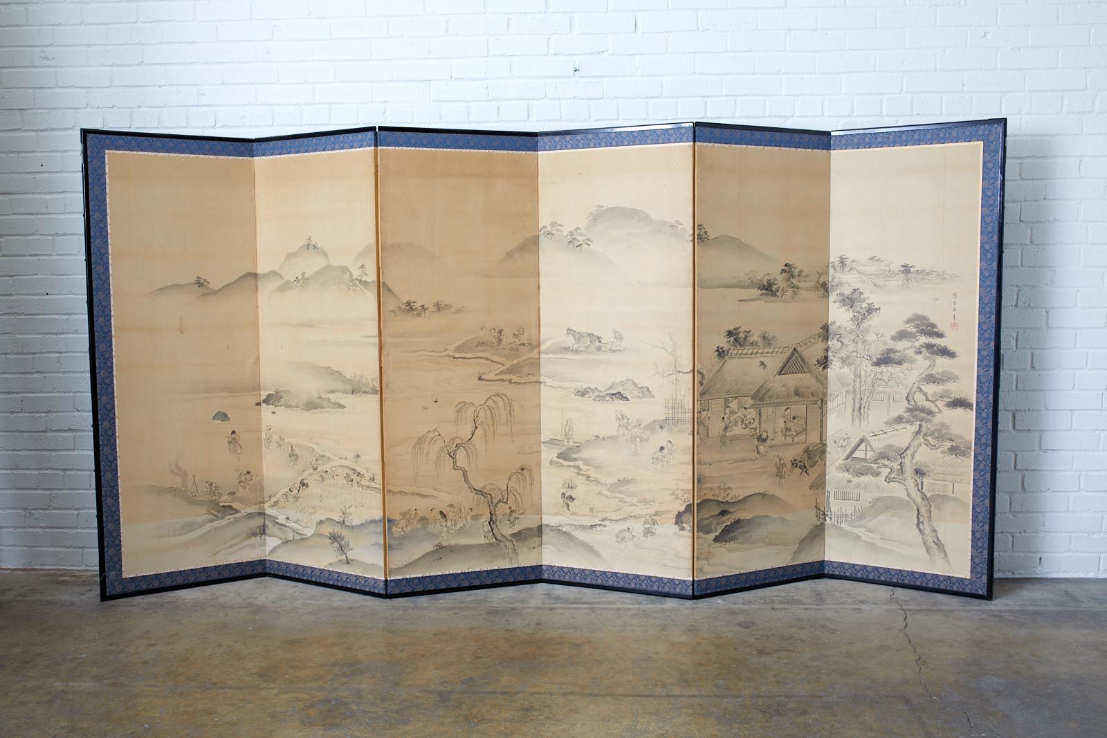 Large 18th century Japanese six panel Edo period screen depicting village farming and agricultural landscape scenes. Ink on paper painting signed from the brush of Fujiwara Morimasa with seal made in the Maruyama-Shijo school style. The screen