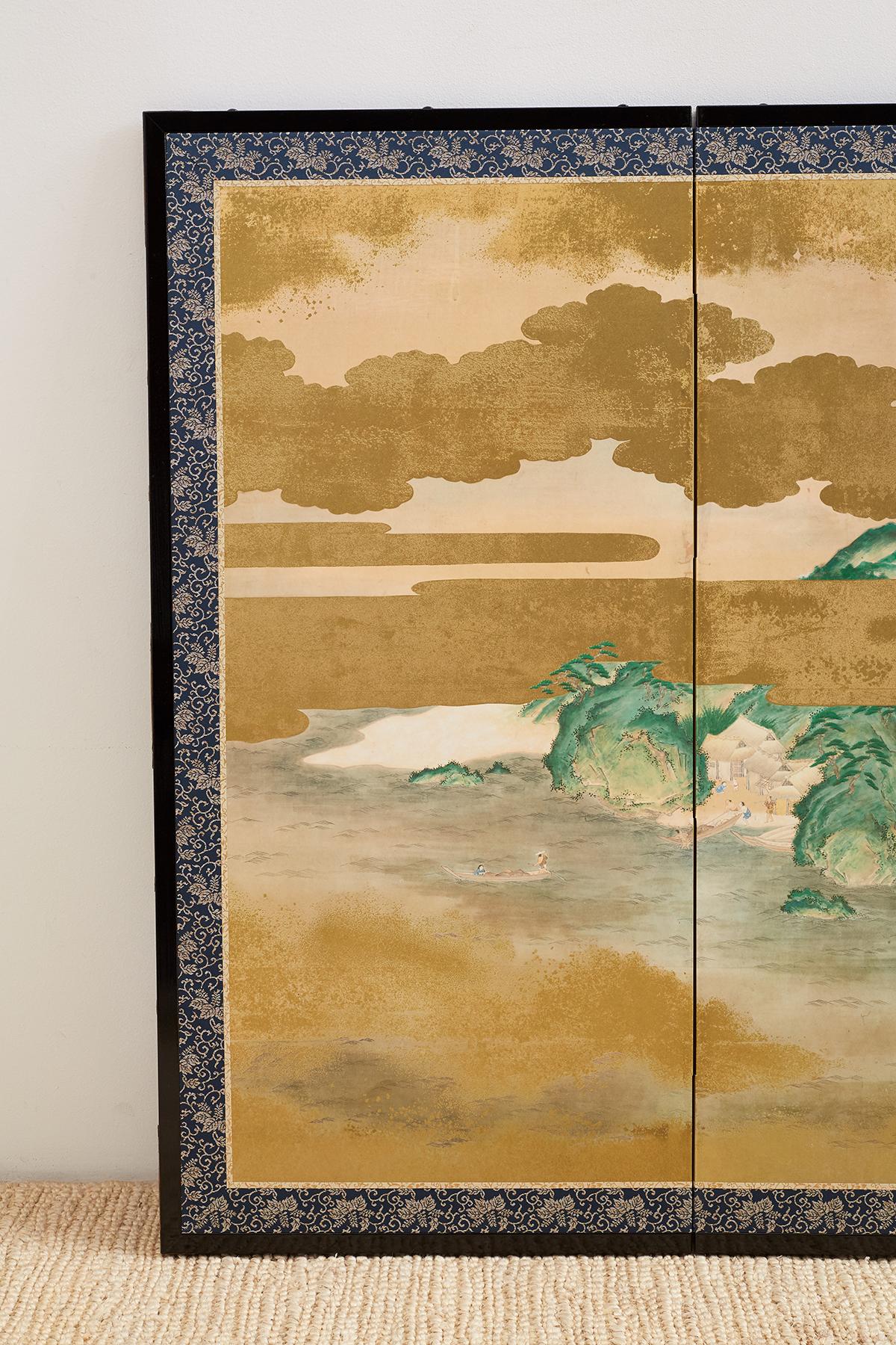 Large Japanese six-panel Byobu screen depicting an aerial view of a village with a river and mountain background. Painted in the Kano school style appearing to be from a narrative tale. Intricately painted villagers among houses and pagodas with
