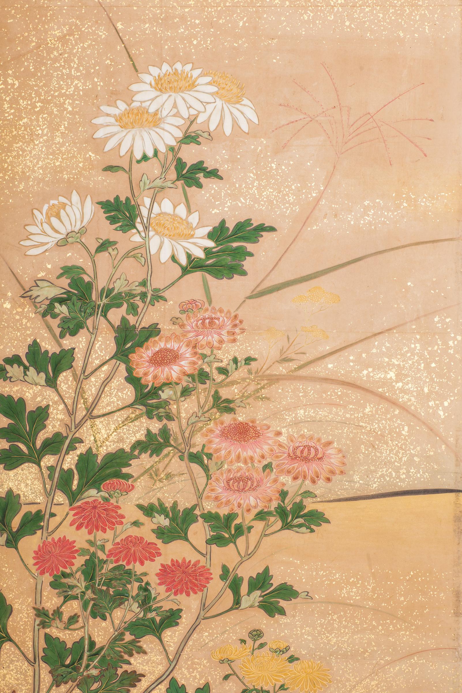 Japanese six-panel screen: Chrysanthemums, Edo period (circa 1800) painting of a variety of chrysanthemums in a garden landscape, with sparrows. Mineral pigments on paper with gold dust and a silk brocade border. Signature reads: Mutsu.