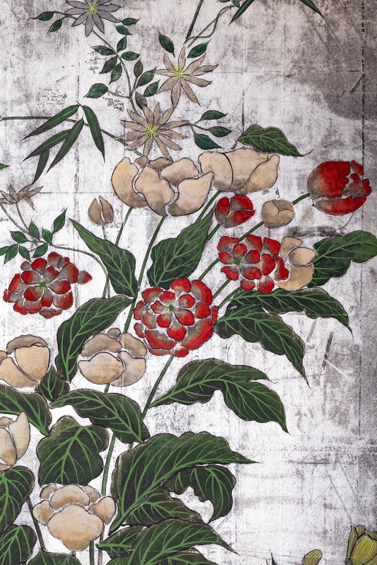 Various types of flowers beautifully balanced on a silver leaf ground. Mineral pigments on silver leaf with brocade border.