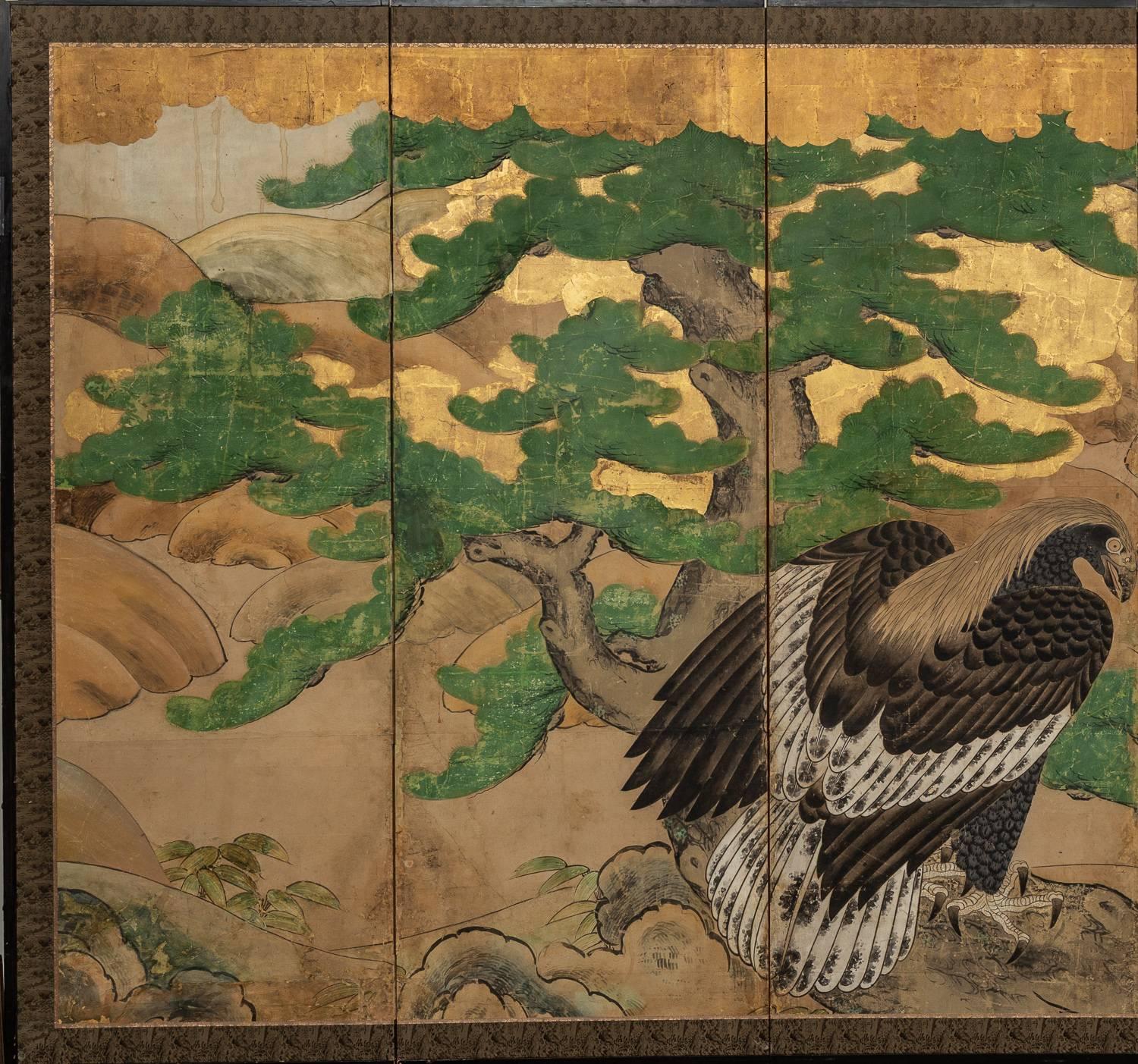 Beautiful and dramatic Kano school painting of a hawk perched on a rock.  With flowering cherry, peonies, pine and bamboo.  Twig fence on the right is made of heavily oxidized silver and suggests a garden scene.
Heavy gold, silver, mineral pigments