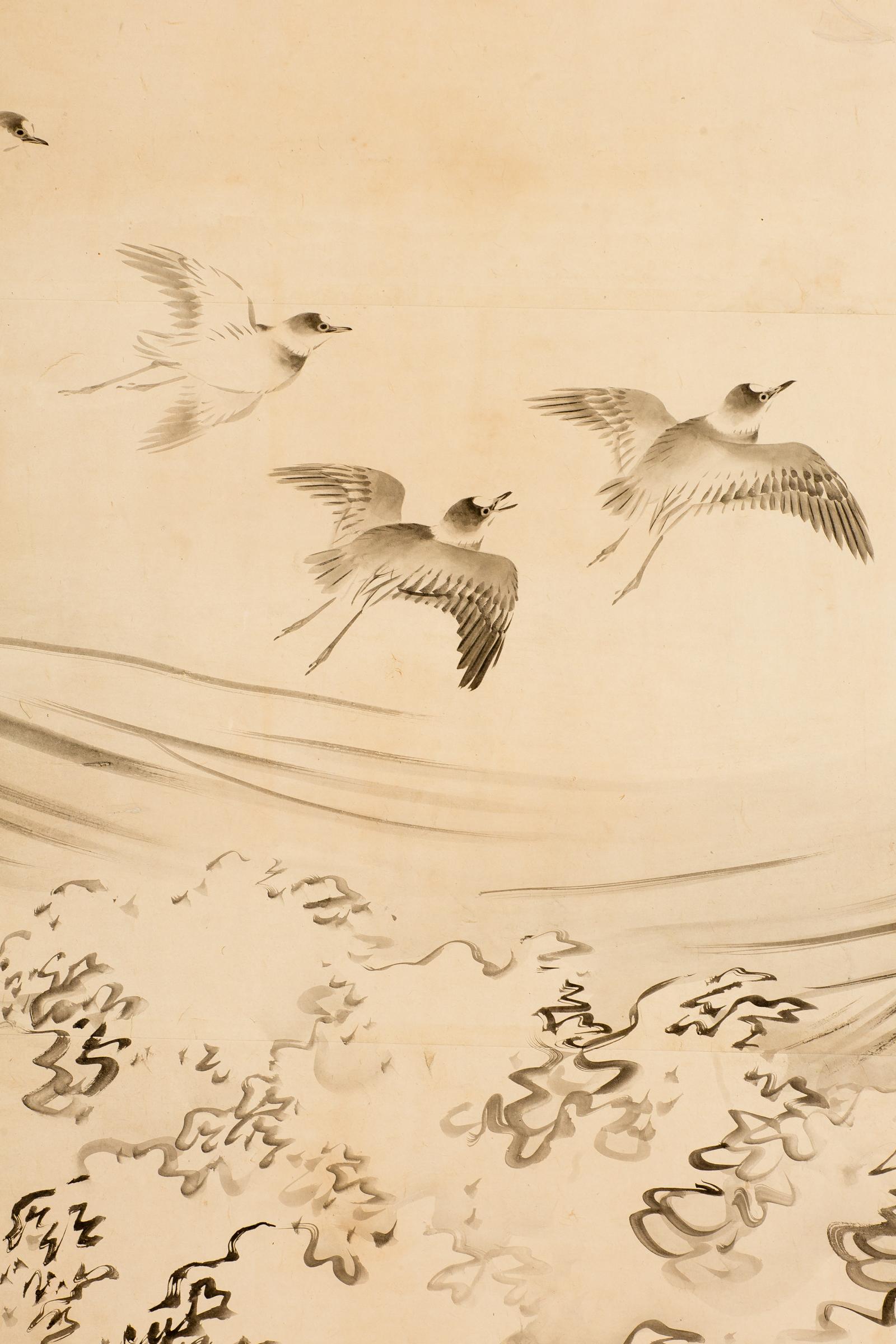 Japanese six-panel screen, open ocean, late Edo - early Meiji period, circa 1870, painting of plovers flying over cresting waves. Sumi ink on mulberry paper with a silk brocade border, good condition. Signature and seal read: Hayashi Ranga. One of a