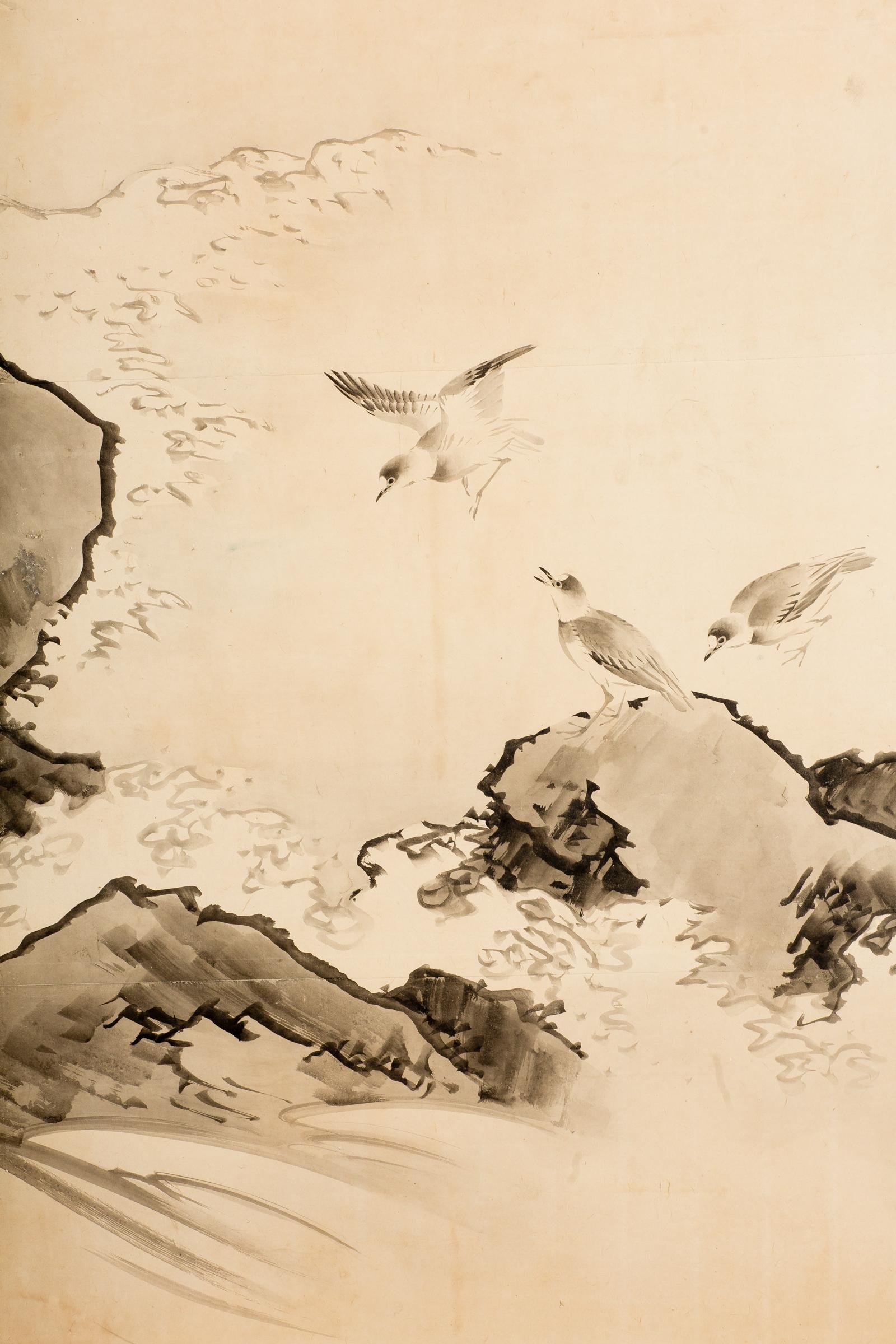 Japanese six-panel screen: Plovers in flight over coastal landscape. Late Edo - Early Meiji period, circa 1870, painting of plovers flying over cresting waves. Sumi ink on mulberry paper with a silk brocade border, good condition. Signature and seal